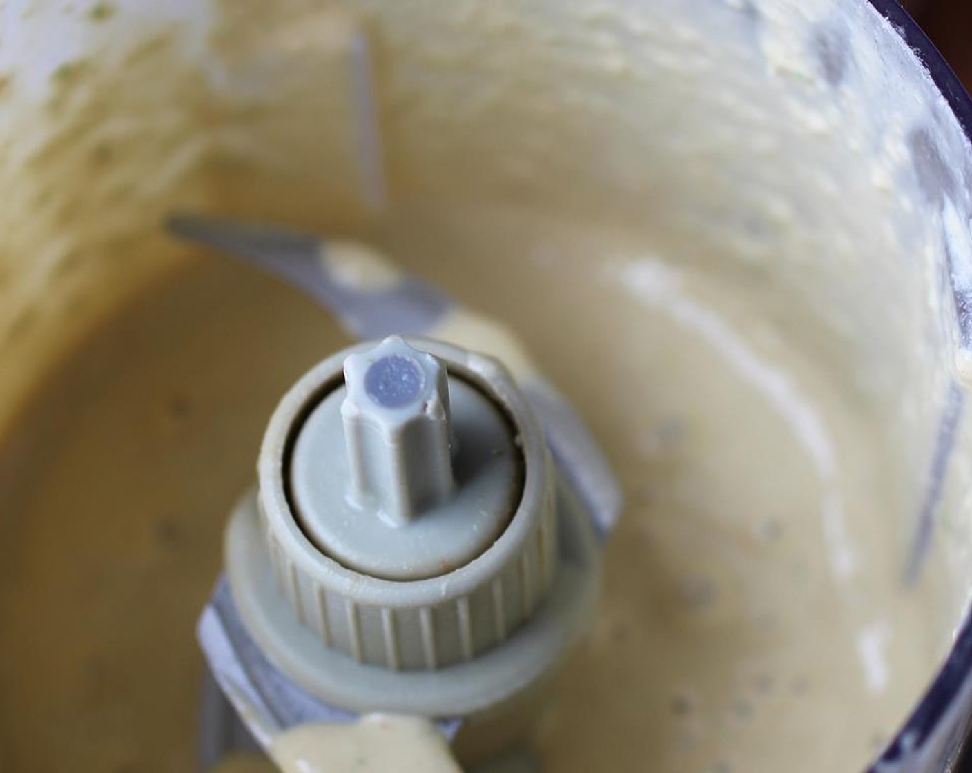 step 7 To make the Peanut Sauce, cut the Jalapeño Pepper (1)  in half and remove the seeds. Place the Peanut Butter (1/4 cup), jalapeno, a Garlic (1 clove), juice from the rest of the lime, Low-Fat Coconut Milk (2 Tbsp) and a tablespoon of water in the food processor. Pulse until the jalapeño and garlic are chopped up and everything is well mixed together and incorporated.