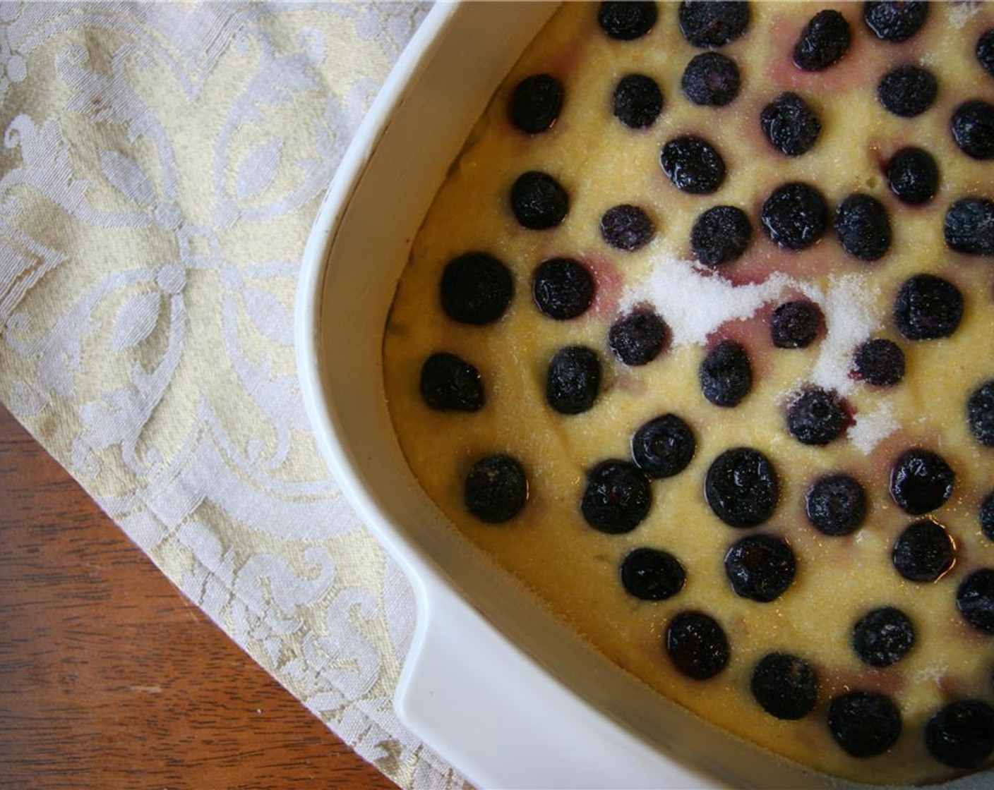 step 5 Dot with Fresh Blueberry (1 cup) and sprinkle Granulated Sugar (2 Tbsp) over top. Bake for 50 minutes until golden and beautiful.