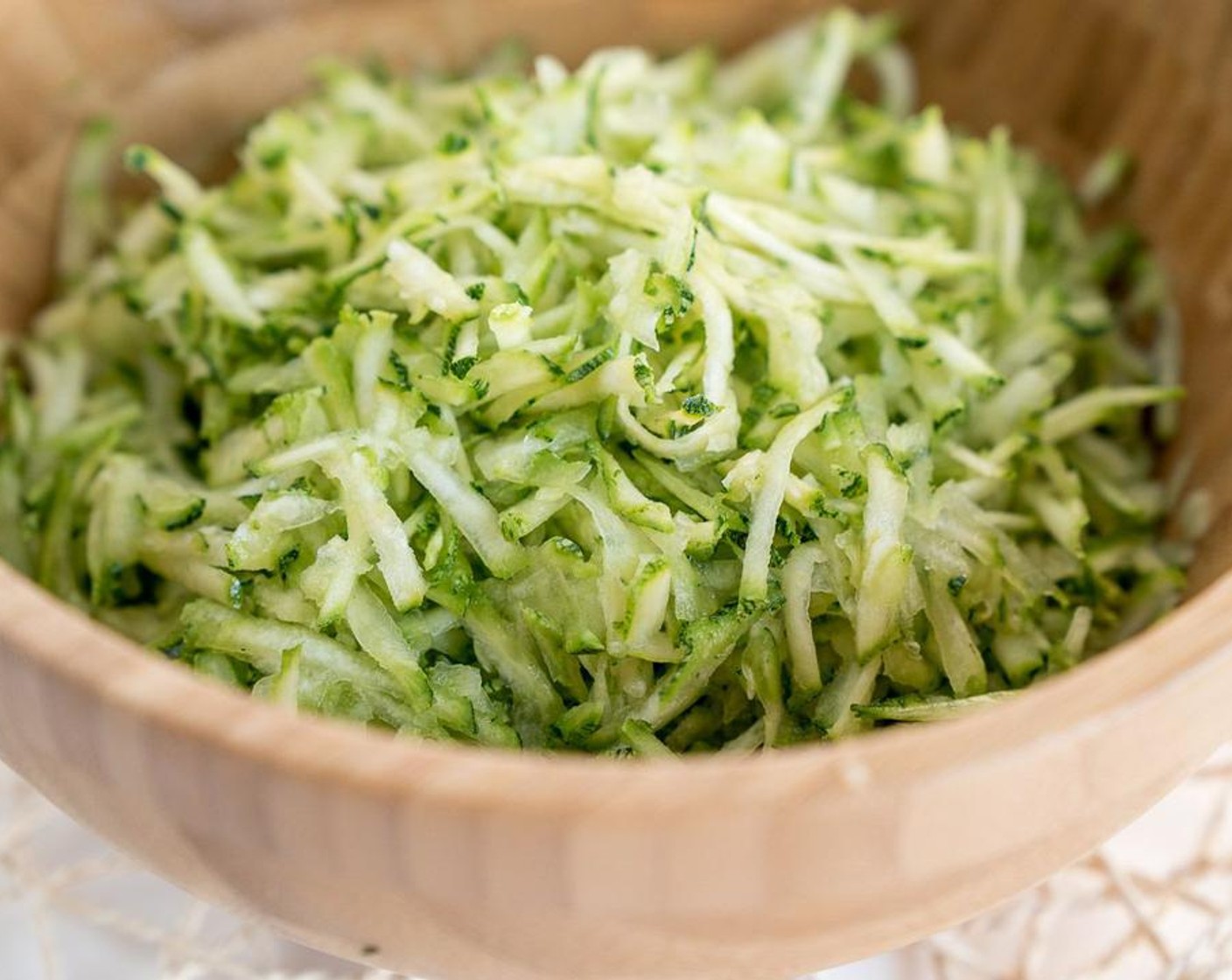 step 2 Grate the Zucchini (2) and drain the excess water with a cheesecloth.