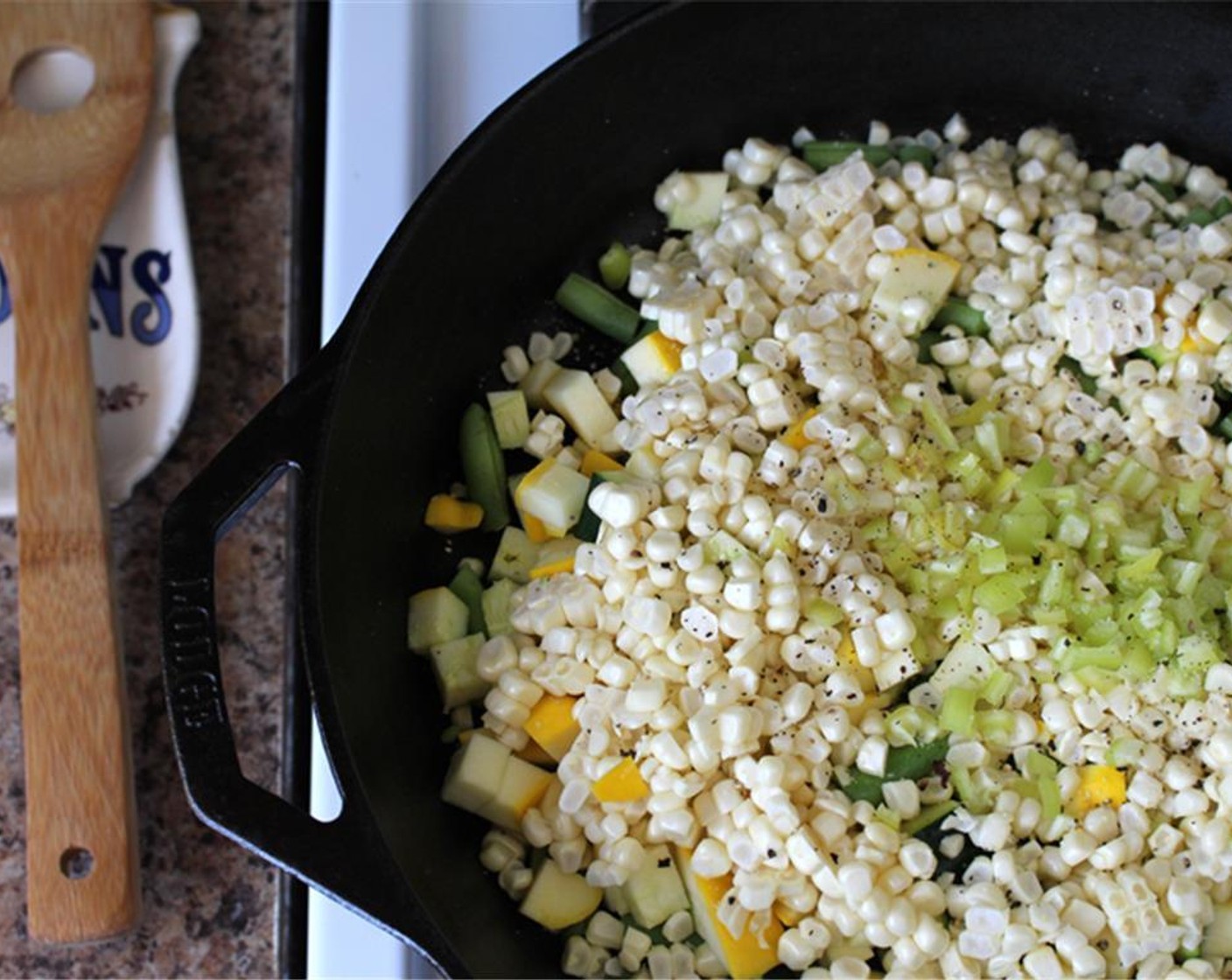 step 2 Heat skillet over medium-low. Add Olive Oil (1 Tbsp). Add the green beans, corn, summer squash and hot pepper. Cook for 5 minutes stirring occasionally.