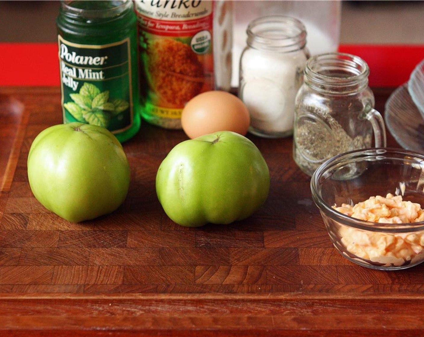 step 2 While the oil heats, slice the Green Tomatoes (2) in half-inch slices, discarding the ends.