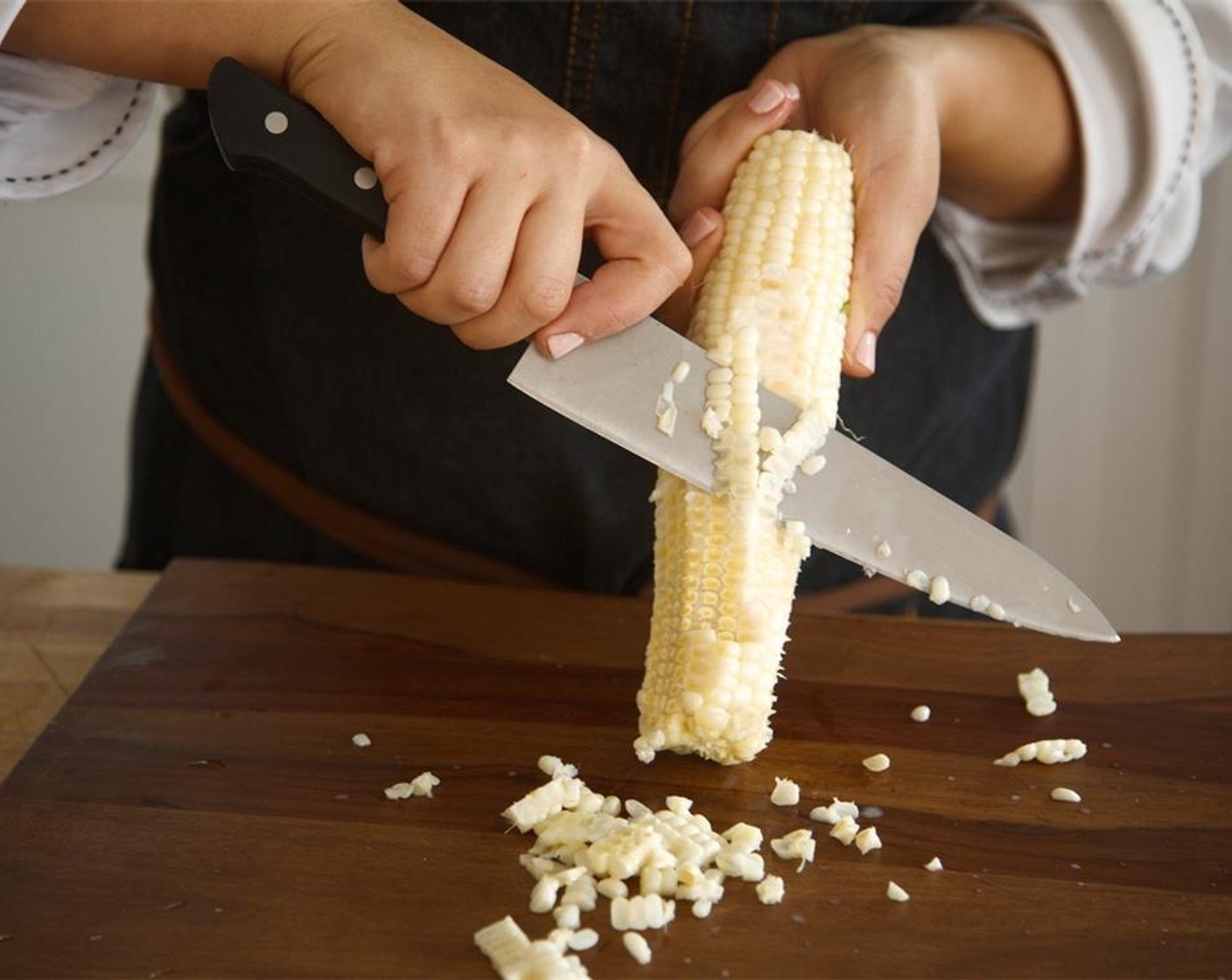 step 6 Slice Corn (1 ear) off the cob and set aside. In a medium saute pan, heat a teaspoon of oil over medium high heat. Add corn, red pepper and Salt (1/4 tsp). Cook for five minutes, stirring frequently until crisp. Add juice from Limes (2). Remove from heat.