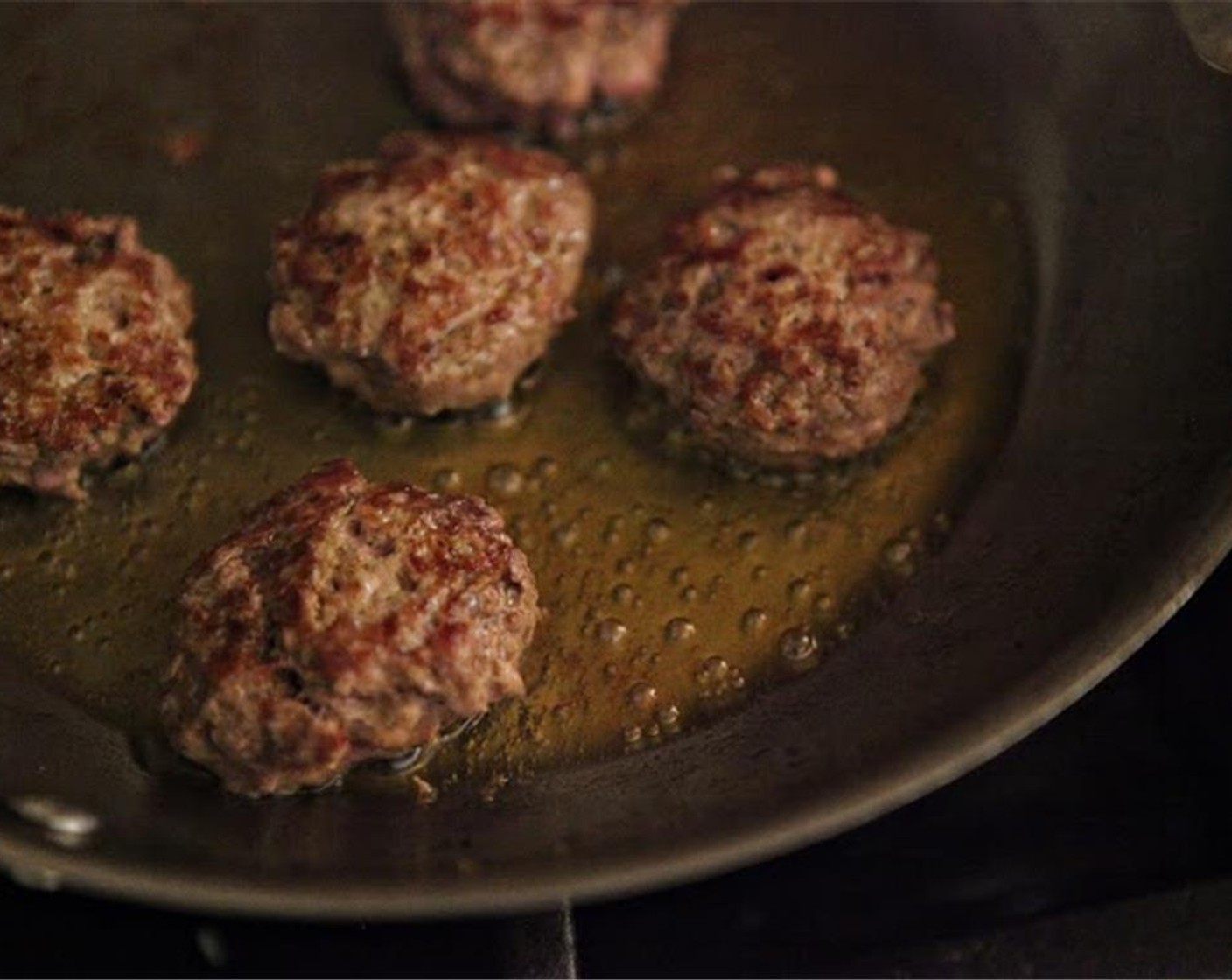 step 5 While rice is cooking, heat a large sauté pan over medium-high heat. Add enough Olive Oil (as needed) to lightly coat the pan. Add the meatballs and brown well on each side. Transfer meatballs to a plate or rimmed container.