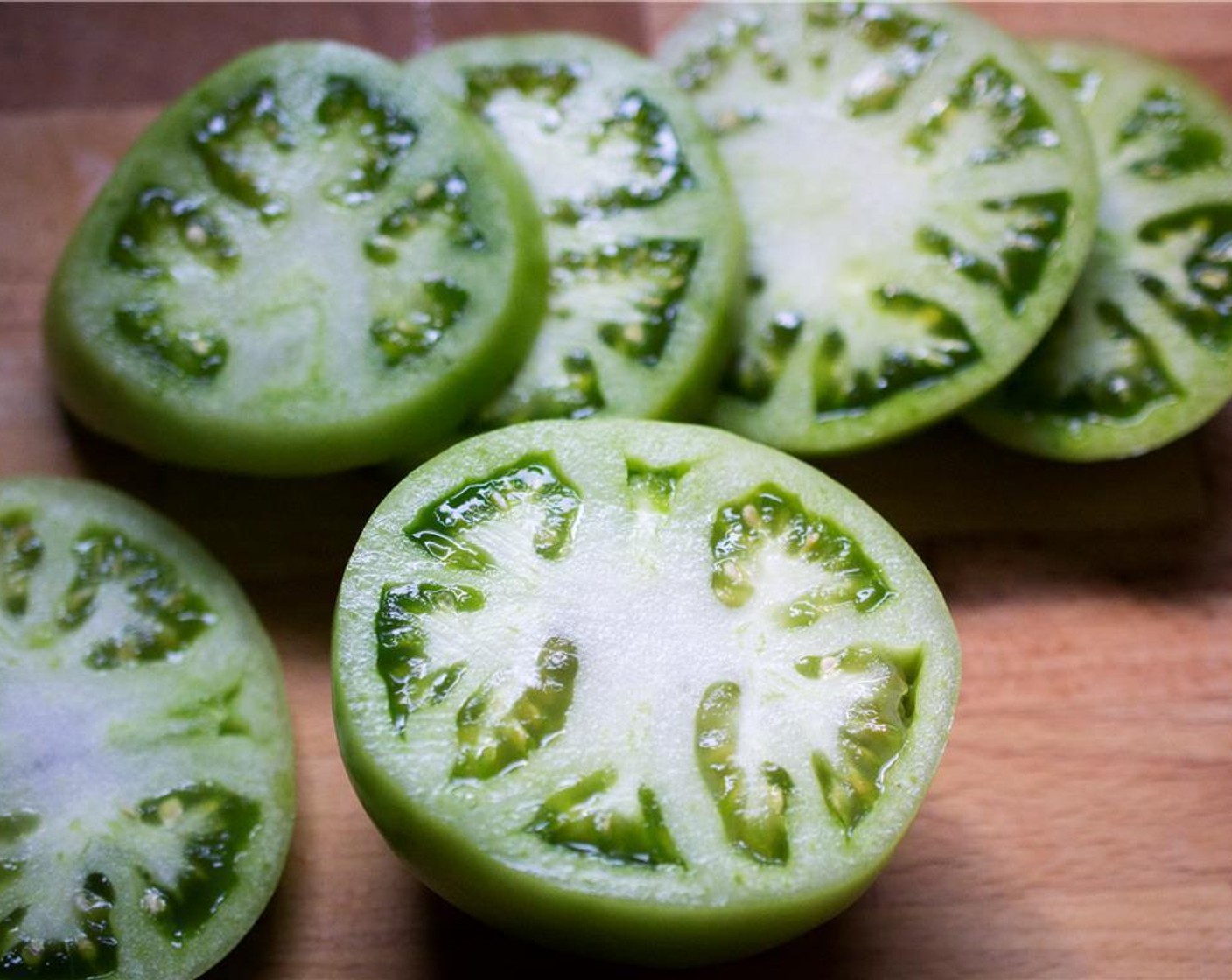 step 2 Cut the Green Tomatoes (4) into 1/4 inch slices, ends removed.