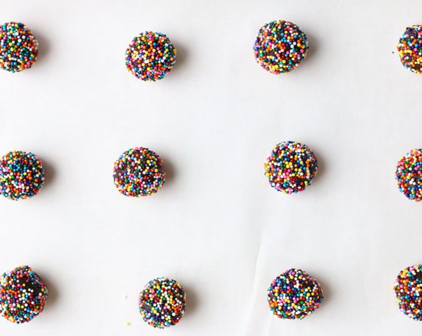 step 6 Roll dough into one-inch balls, roll in Sprinkles (3/4 cup). Place 2 inches apart on prepared baking sheets. Bake for 10-11 minutes or until cookies are set.