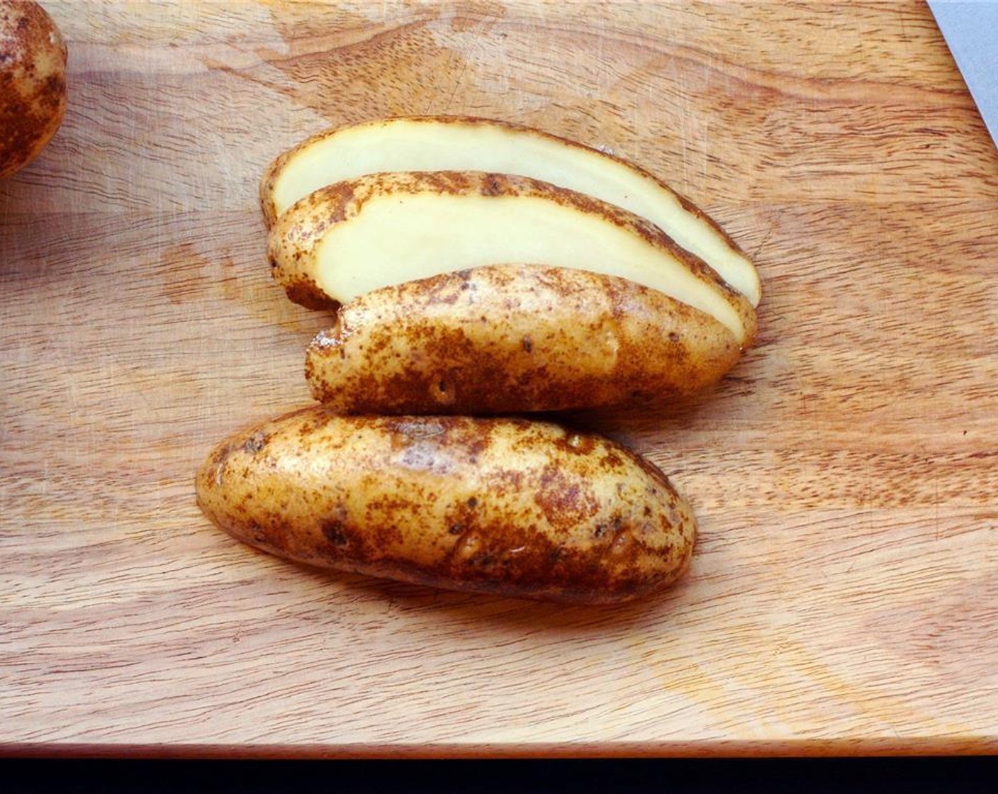 step 2 Slice each potato into 3/8″ sheets.