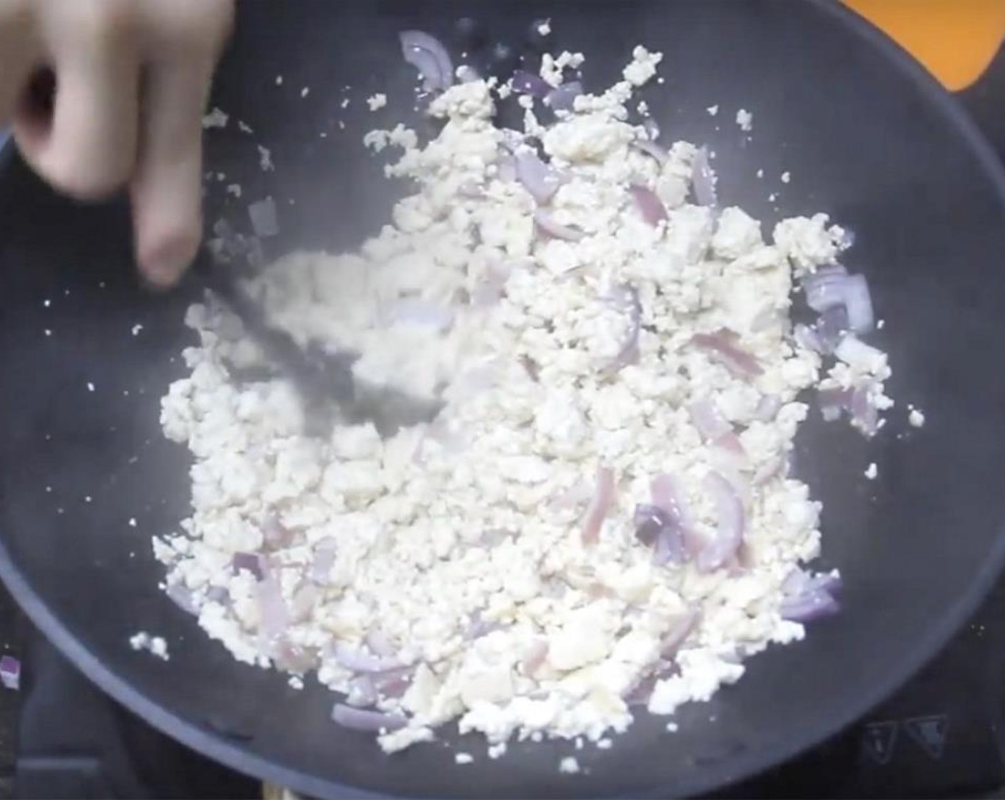 step 9 Add in crumbled tofu and stir-fry until it becomes dry and slightly firm. It will take a few minutes.