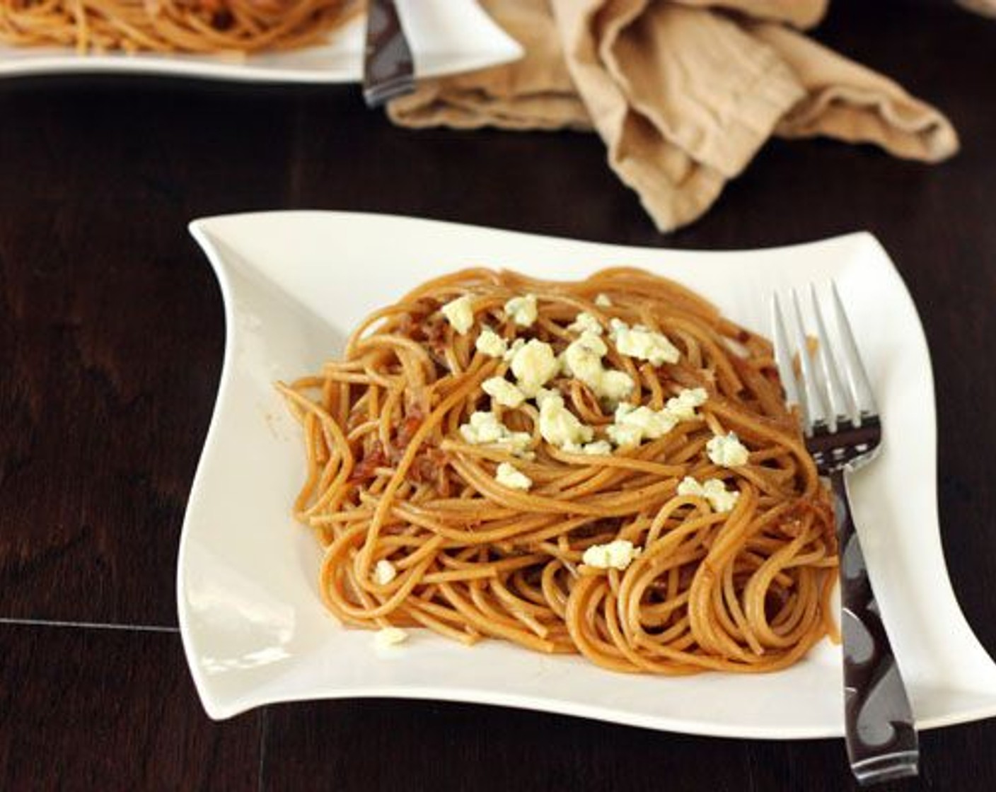 step 7 Plate the spaghetti and add a few crumbles of Gorgonzola Cheese (1/2 cup) as a garnish.