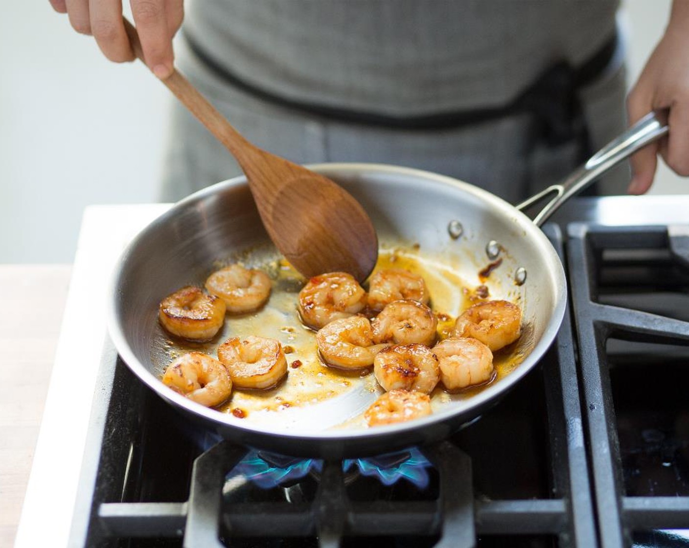 step 6 Add the baby bok choy and shrimp to the pan with Vegetable Oil (1 Tbsp) and continue to cook while moving the pan around for another 1 to 2 minutes, until the shrimp is cooked through and the baby bok choy is tender but still crunchy.