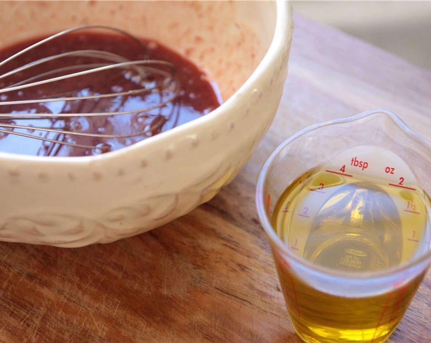 step 2 Slowly whisk in the Olive Oil (1/4 cup), and then the Honey (1 Tbsp) until fully combined. Season to taste with Salt (to taste) and Ground Black Pepper (to taste).