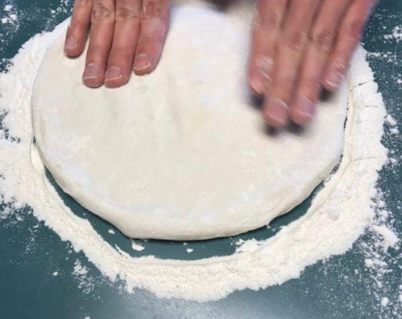 step 4 Once Pizza Dough (1) is raised, shape into roughly a 10" pie. Use generous amounts of flour so the dough doesn't stick to the working surface.