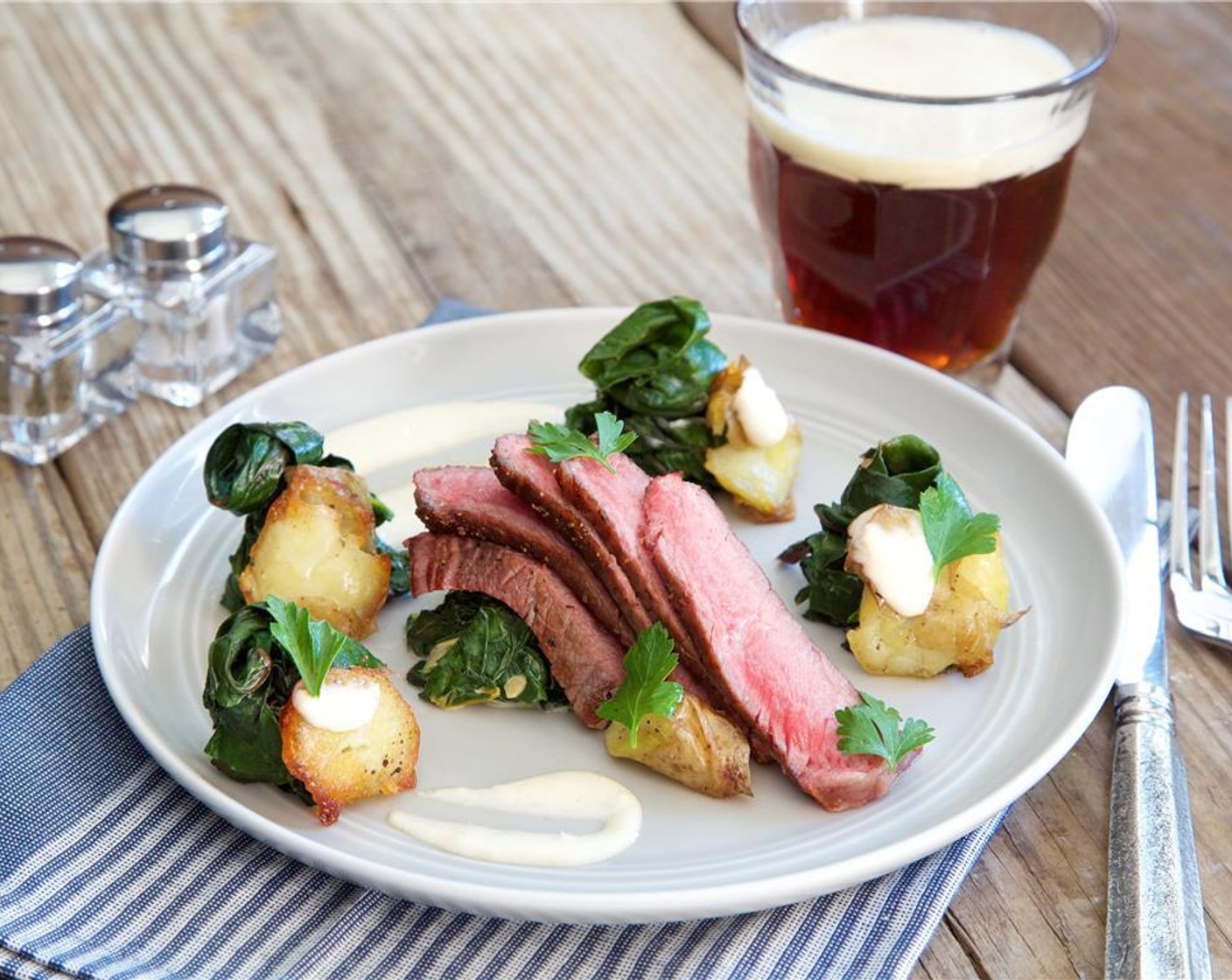 step 14 Fan out the sliced steak in a narrow pattern in the center of the plates and garnish with the parsley leaves. Enjoy your elegant meal!