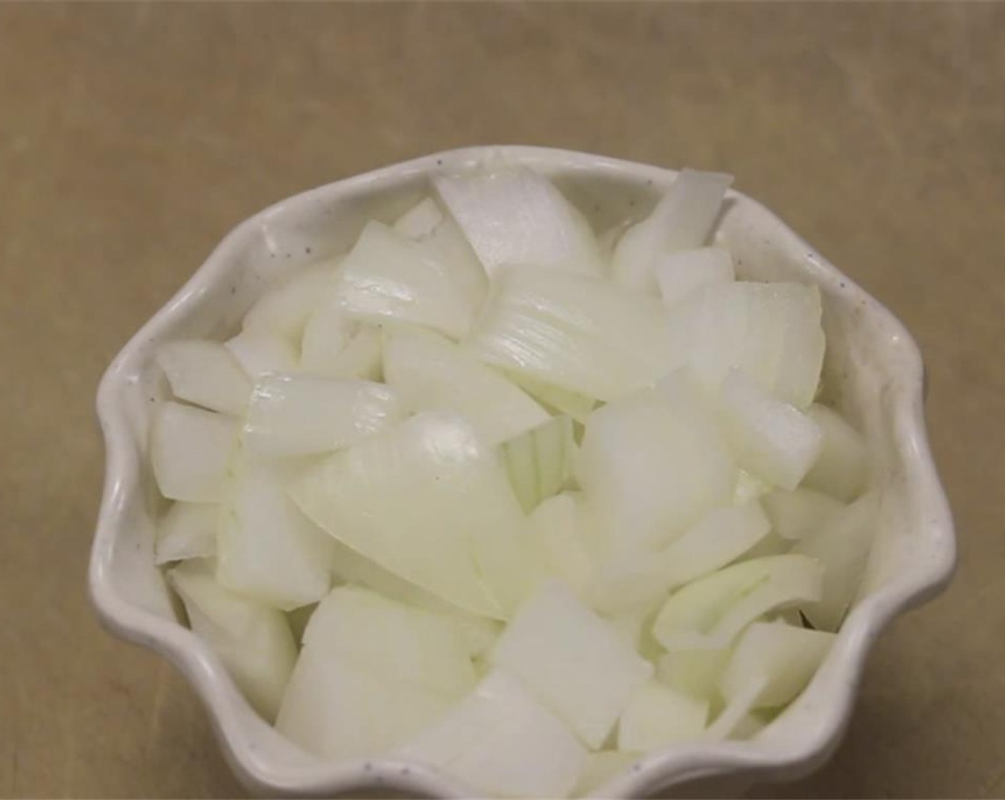 step 9 Dice your Onion (1/2 cup) and roughly slice Scallion (1 stalk) into strips, using only the green portion.