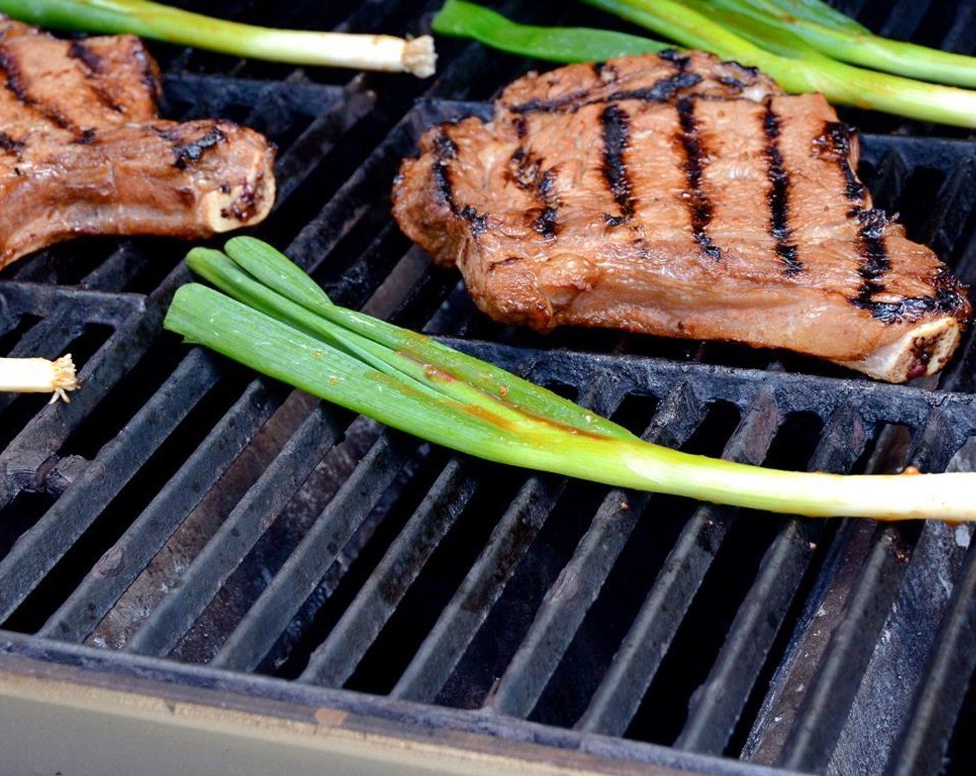 step 13 Cook steaks for 7 to 9 minutes for medium rare - medium, turning them about halfway through the cooking. Grill the green onions for about 5 minutes total. Baste both the steak and the green onions with reserved marinade.