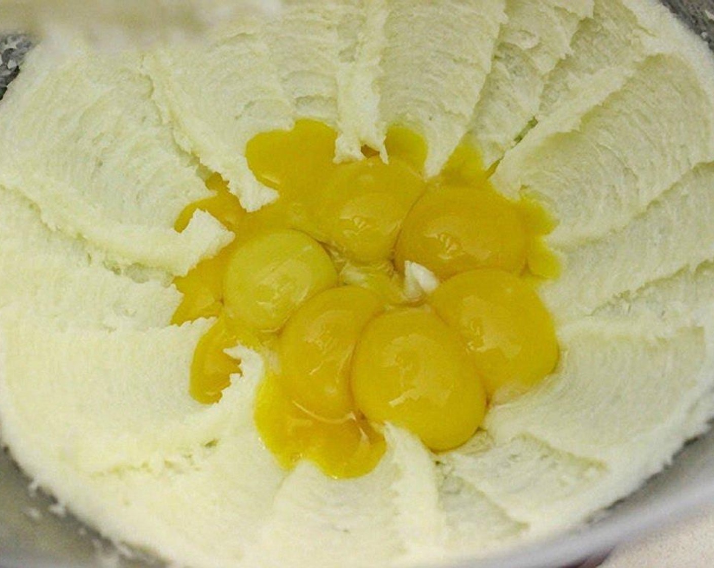 step 6 Separate the Eggland's Best Classic Eggs (8) yolks and egg whites. Save egg whites in a small bowl for later. Add in the 8 egg yolks.