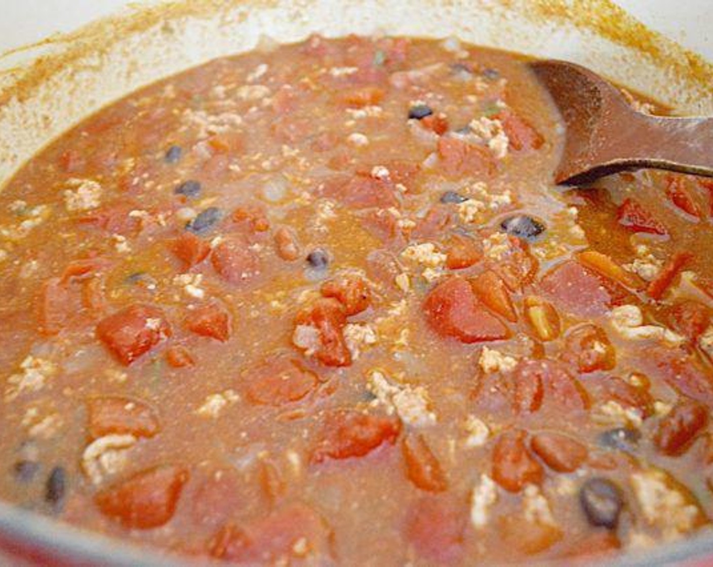 step 6 Pour in the Black Beans (1 can), Red Kidney Beans (1 can), and Diced Tomatoes (1 can) with their liquid. Bring it to a low boil, then cover the dutch oven and lower the heat to a simmer. Let it simmer for 35-40 minutes.