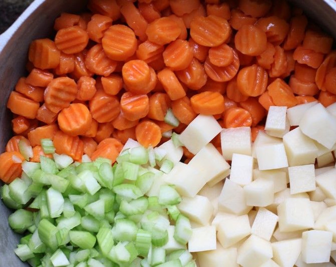 step 4 In a large saucepan, combine Yukon Gold Potato (1 cup), Carrots (2), and Celery (1). Add water to cover and bring to a boil; reduce heat and simmer for 12 minutes or until the vegies are tender.