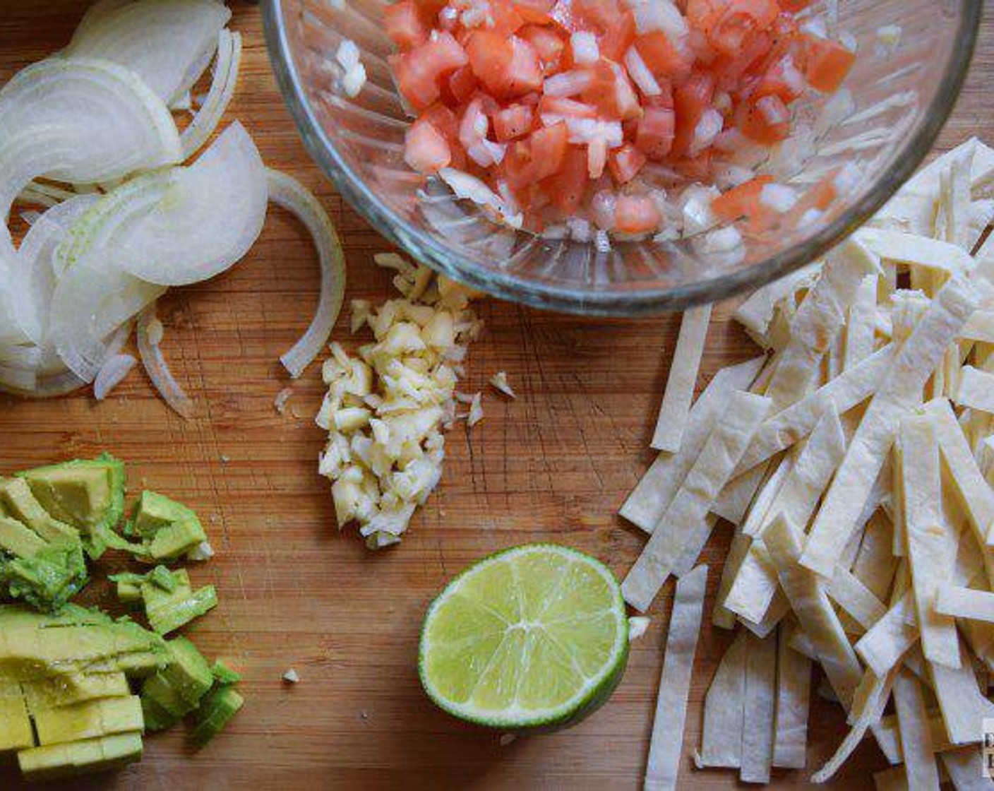 step 1 In a bowl, combine Yellow Onion (1/2), Garlic (1 clove),Roma Tomato (1), and Avocado (1) with Lime (1/2).