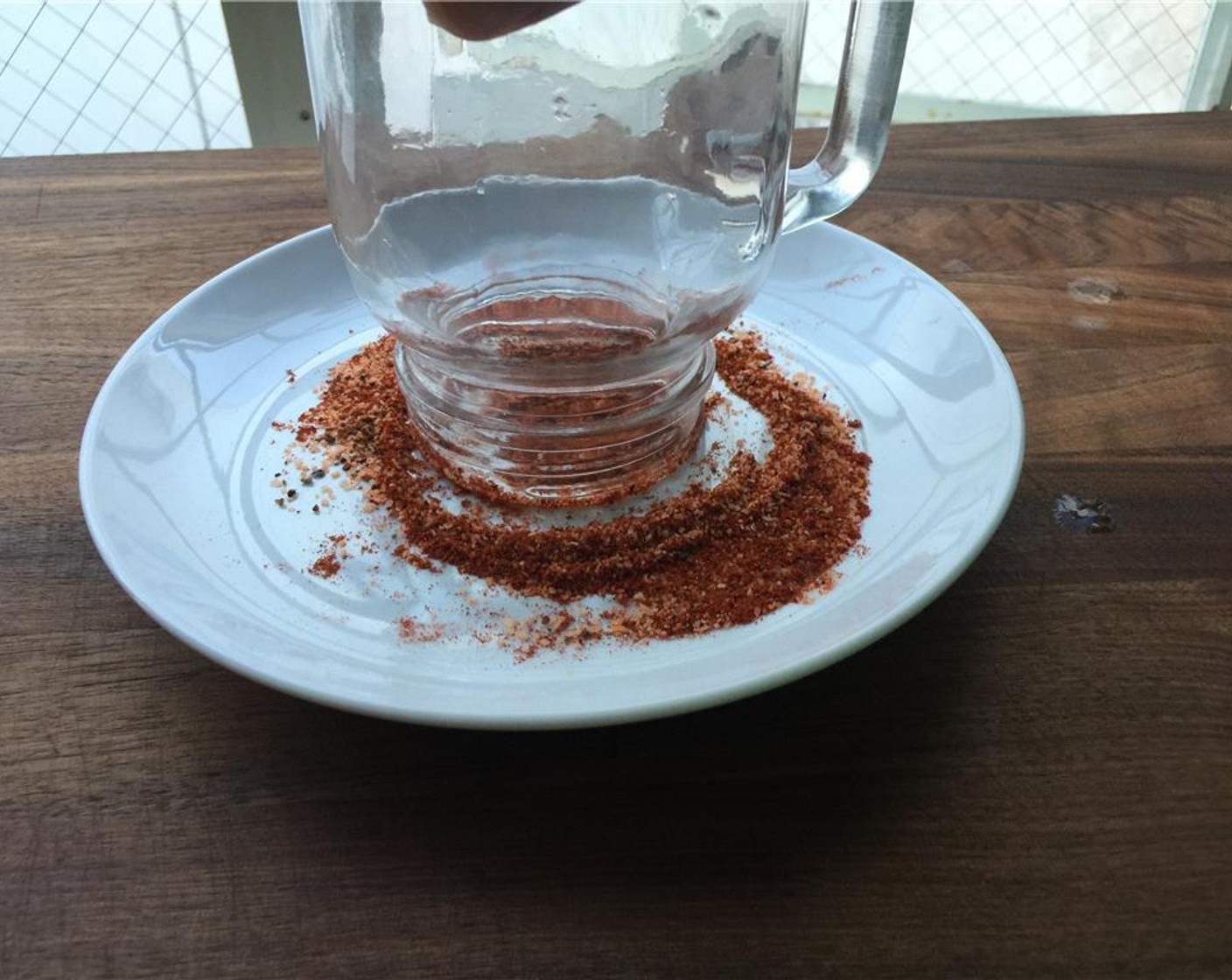 step 2 Combine Salt (1/2 tsp), Freshly Ground Black Pepper (1/2 tsp) and Chili Powder (1/2 tsp) on a small plate. Rim the glass with a Lime Wedge and then rim the glass in the salt mixture.
