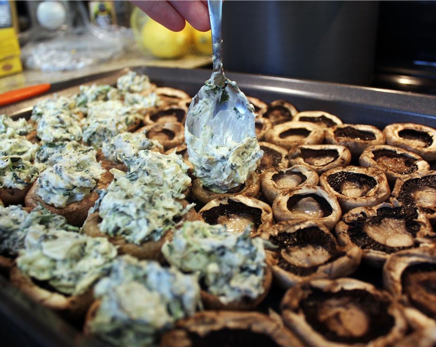 step 11 Flip the portobello mushrooms (12) over, fill each mushroom with some of the filling. Sprinkle parmesan cheese (1 cup) on top and put back in the oven at 425 degrees F (220 degrees C). Season with Salt (to taste) and Ground Black Pepper (to taste).