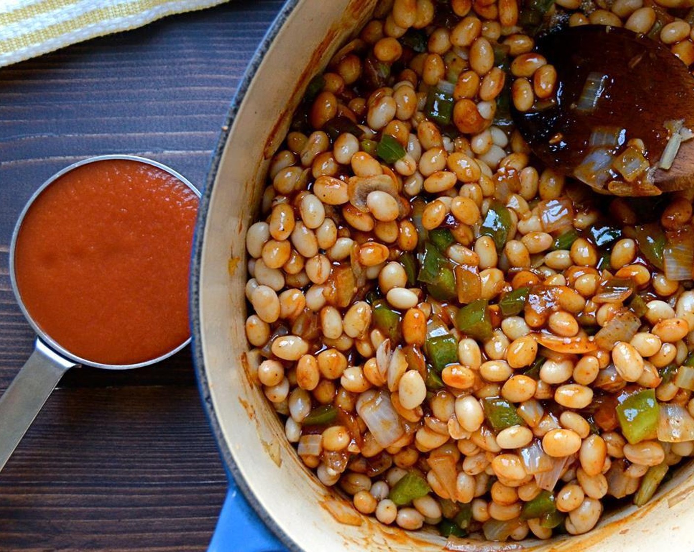 step 5 Remove from heat and add White Beans (2 cans), Barbecue Sauce (1 cup), Tomato Sauce (1/2 cup), yellow Yellow Mustard (1 Tbsp) and Water (1/4 cup). Stir to combine.