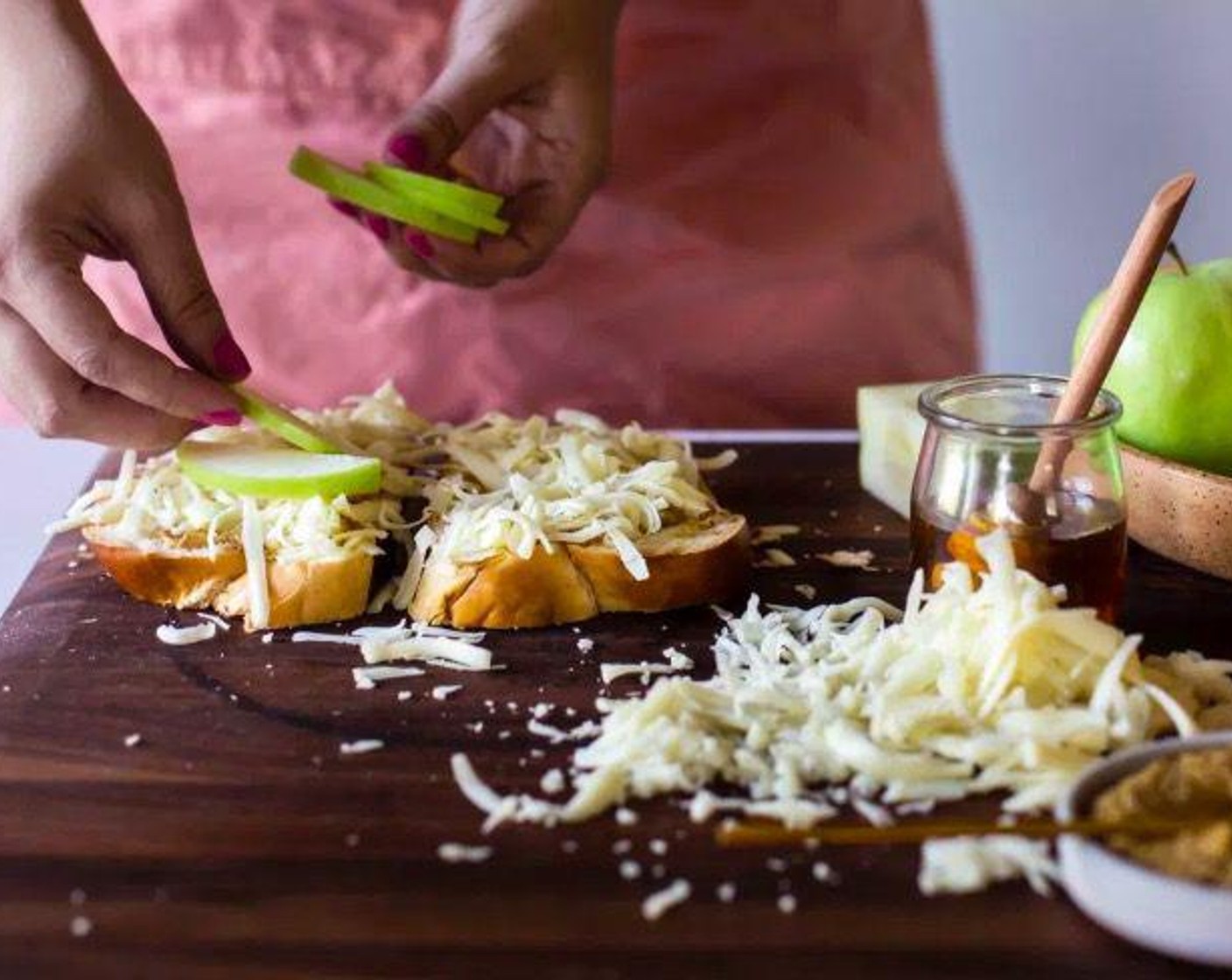 step 2 Sprinkle with Monterey Jack Cheese (2 cups). Add 4-6 slices of Granny Smith Apple (1) to each respective sandwich.