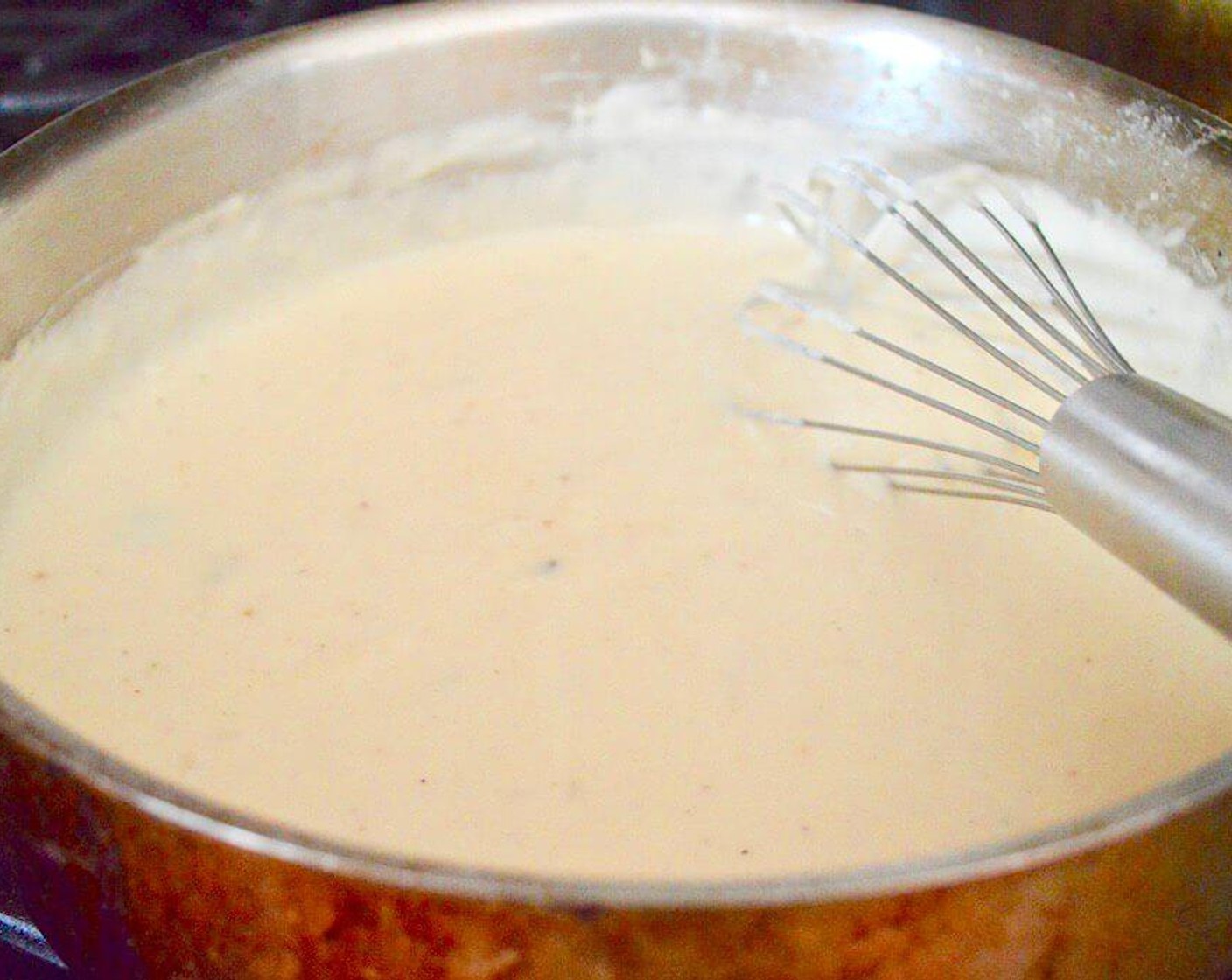 step 5 Then whisk in the Dijon Mustard (1 Tbsp), Ground Nutmeg (1 pinch), and an extra pinch of Salt (1 pinch). Let the sauce gently bubble and thicken for 10 minutes, whisking it occasionally.