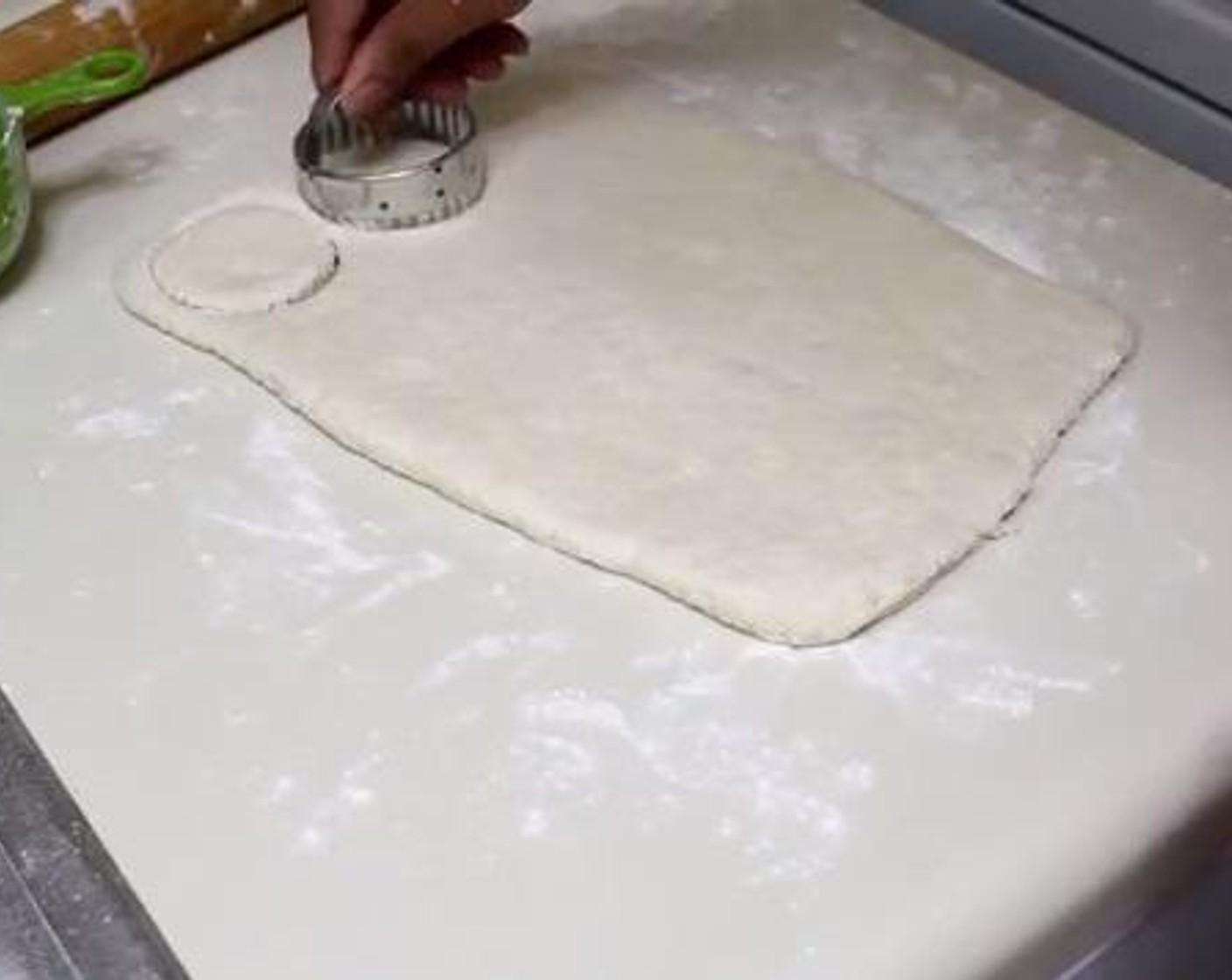step 3 On a floured surface, flatten the dough with a rolling pin and form it into a 10 inch rectangle shape.  Then, using a cookie cutter, cut the dough into pieces.