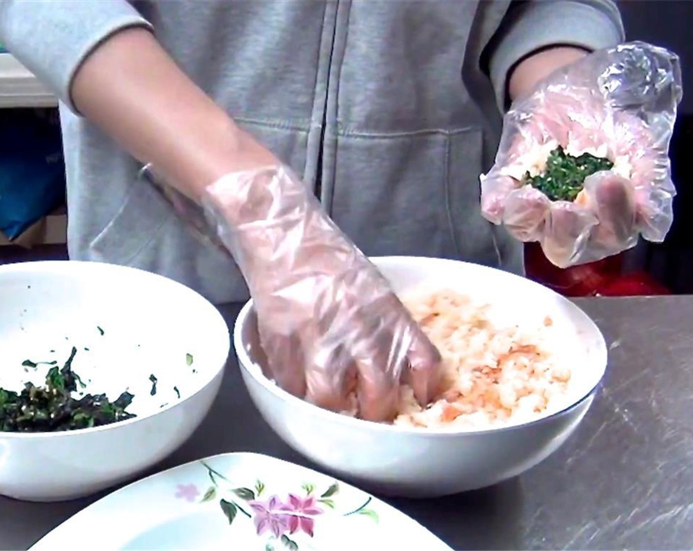 step 7 Make rice balls stuffed with the spinach mixture by first flattening a clump of rice, place​ a spoonful of spinach in the center, and then covering with another clump of rice.