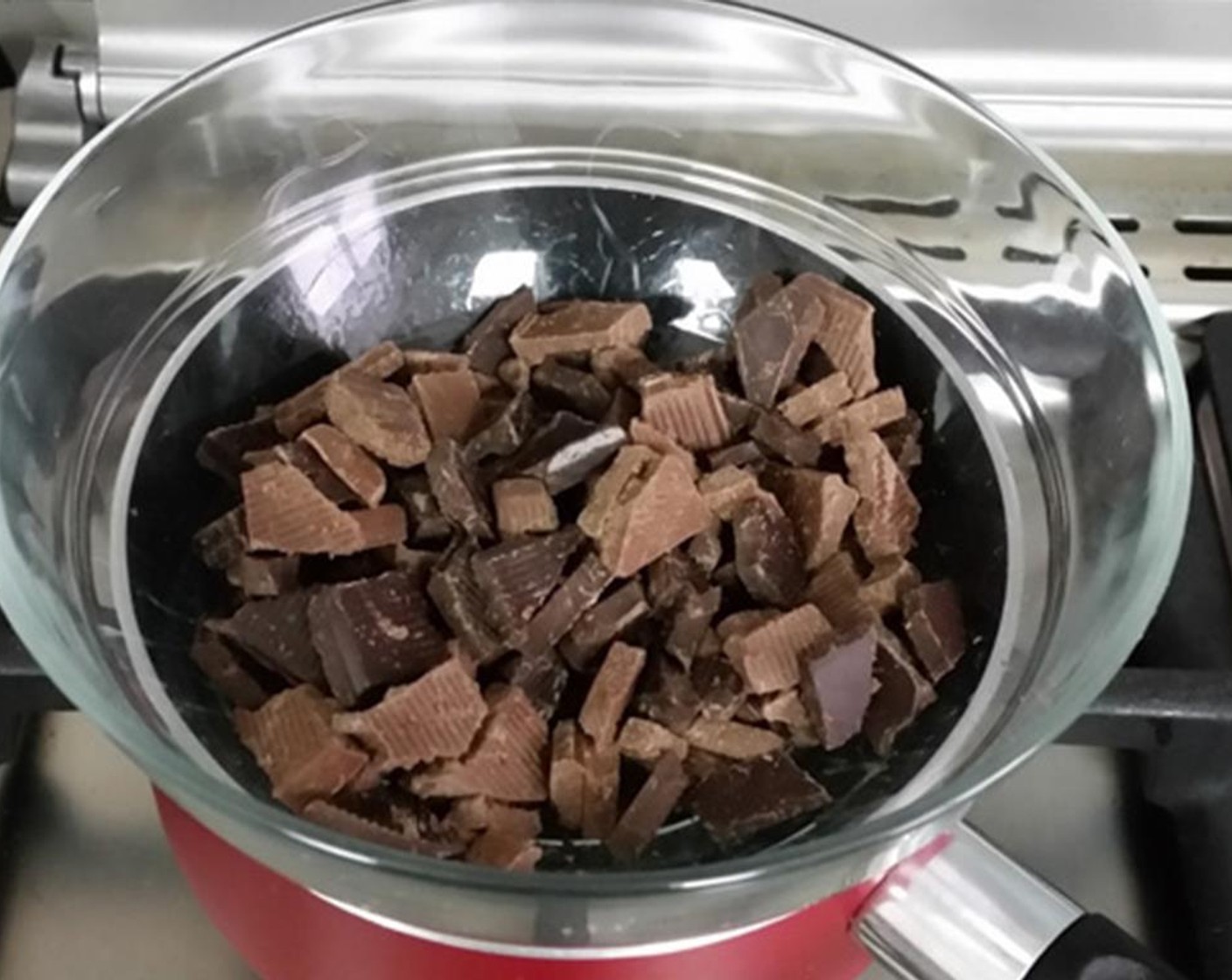 step 2 Place the Bittersweet Chocolate (3/4 cup) in a heat-proof bowl and heat over a small saucepan of barely simmering water or in the microwave until just melted. Set aside and cool completely while stirring often.