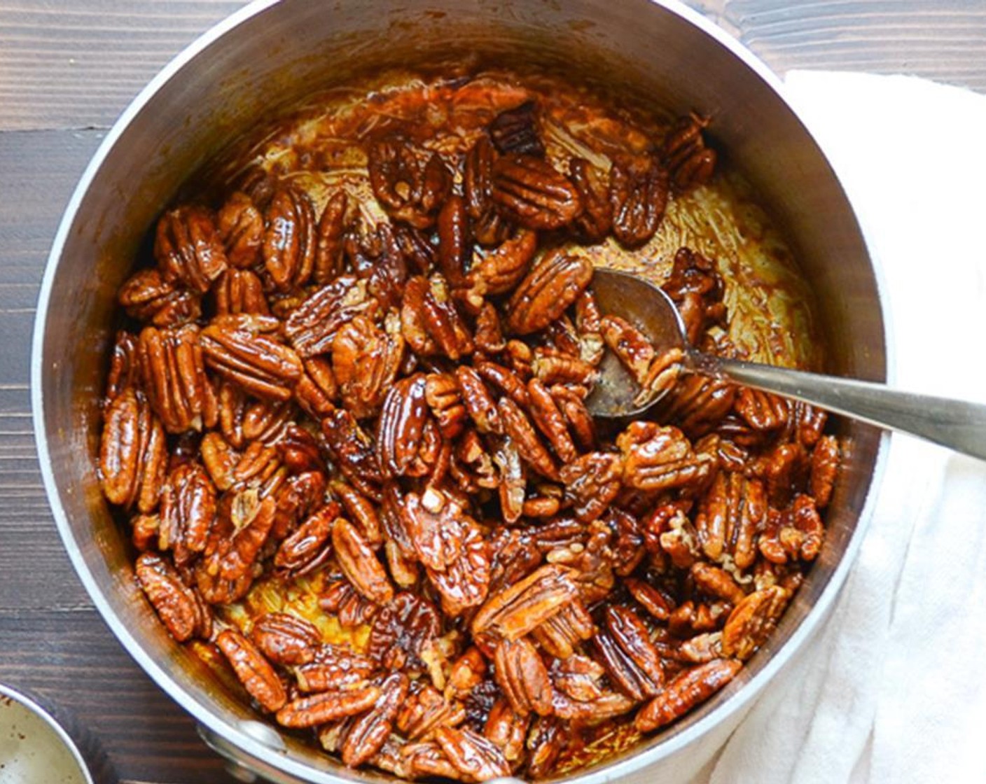 step 2 Heat over medium high heat, stirring constantly. Mixture will foam initially, then subside and begin to toast. The entire cooking cycle should take between 4 to 6 minutes. Pecans and glaze should be very fragrant, but not to the point of burning.