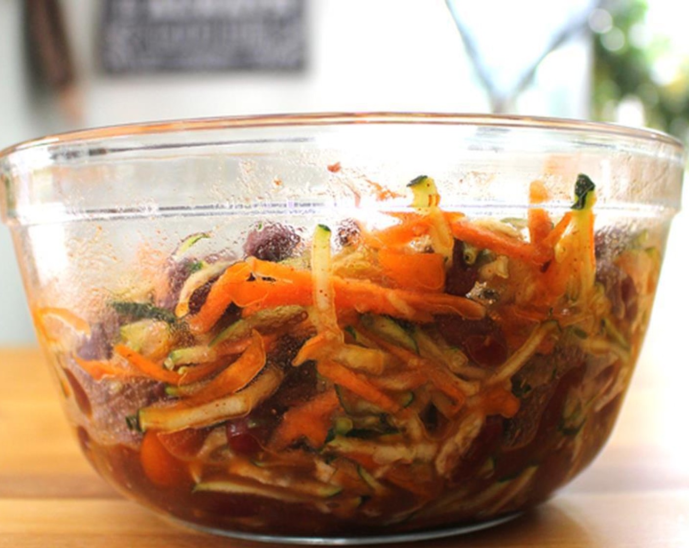 step 3 Whisk in the Balsamic Vinegar (2 Tbsp) and Ground Black Pepper (to taste) in a separate bowl. Pour in some Olive Oil (as needed). Add to the grated vegetables. Toss with Canned Black Beans (1 1/2 cups) and season with Salt (to taste) and Paprika (1 tsp).