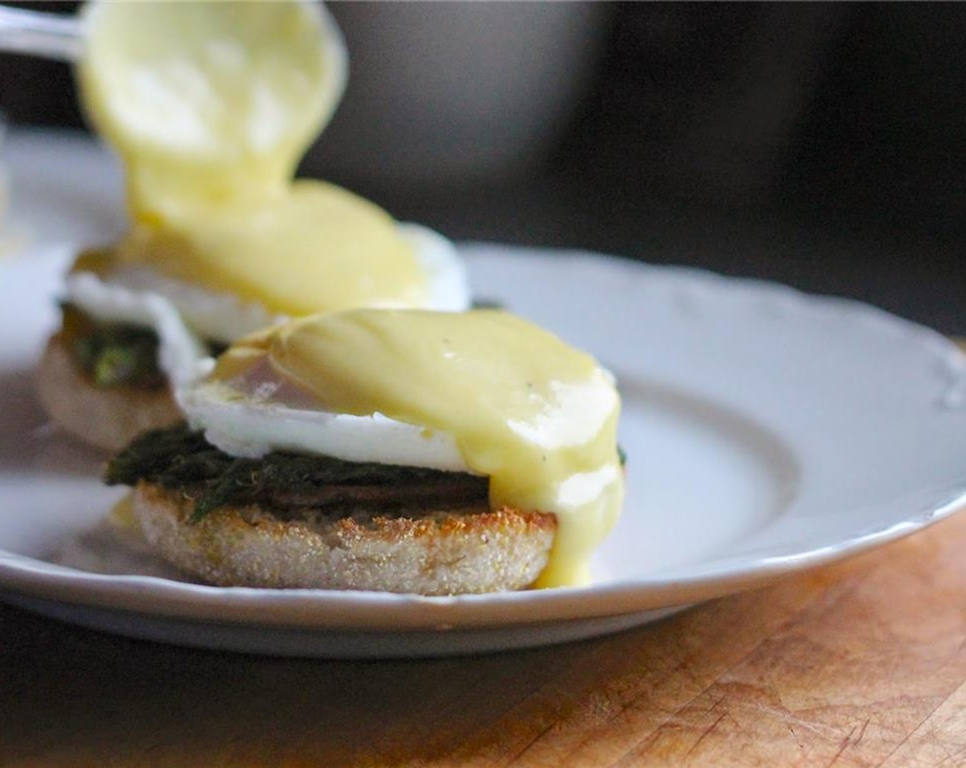 step 17 Place english muffins onto a plate. Layer with Fresh Parsley (to taste), Canadian bacon, asparagus, eggs and Hollandaise sauce.