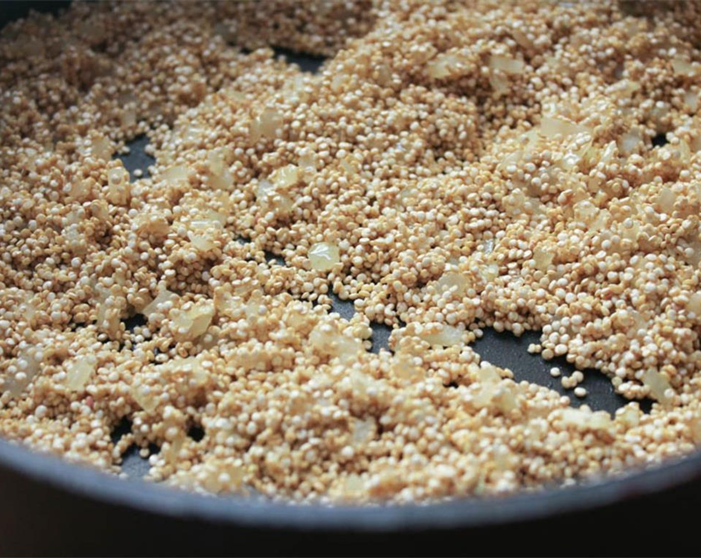 step 10 Add the Quinoa (1 cup) to the pan and stir to coat with oil. Cook for 2 minutes, stirring constantly, until the grains are lightly toasted.