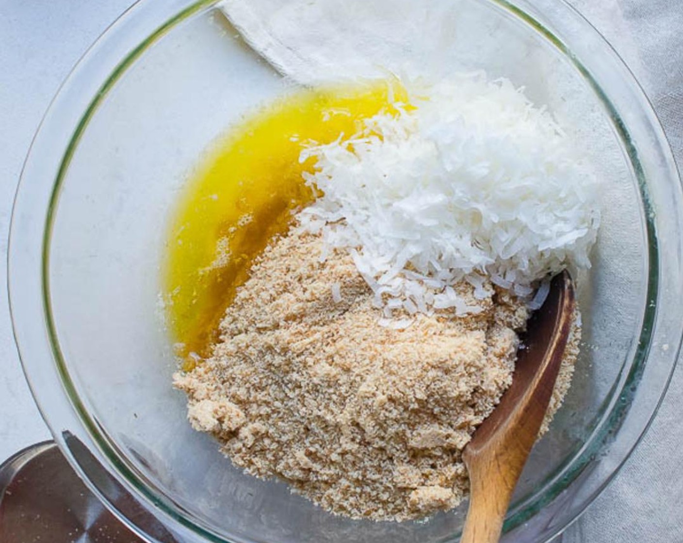 step 2 Add Nilla Wafers (2 cups) and Granulated Sugar (1/4 cup) to the bowl of a food processor and pulse until fine crumbs form. Transfer to a medium bowl and add Sweetened Coconut Flakes (1/2 cup), and Butter (1/3 cup). Toss to combine completely.