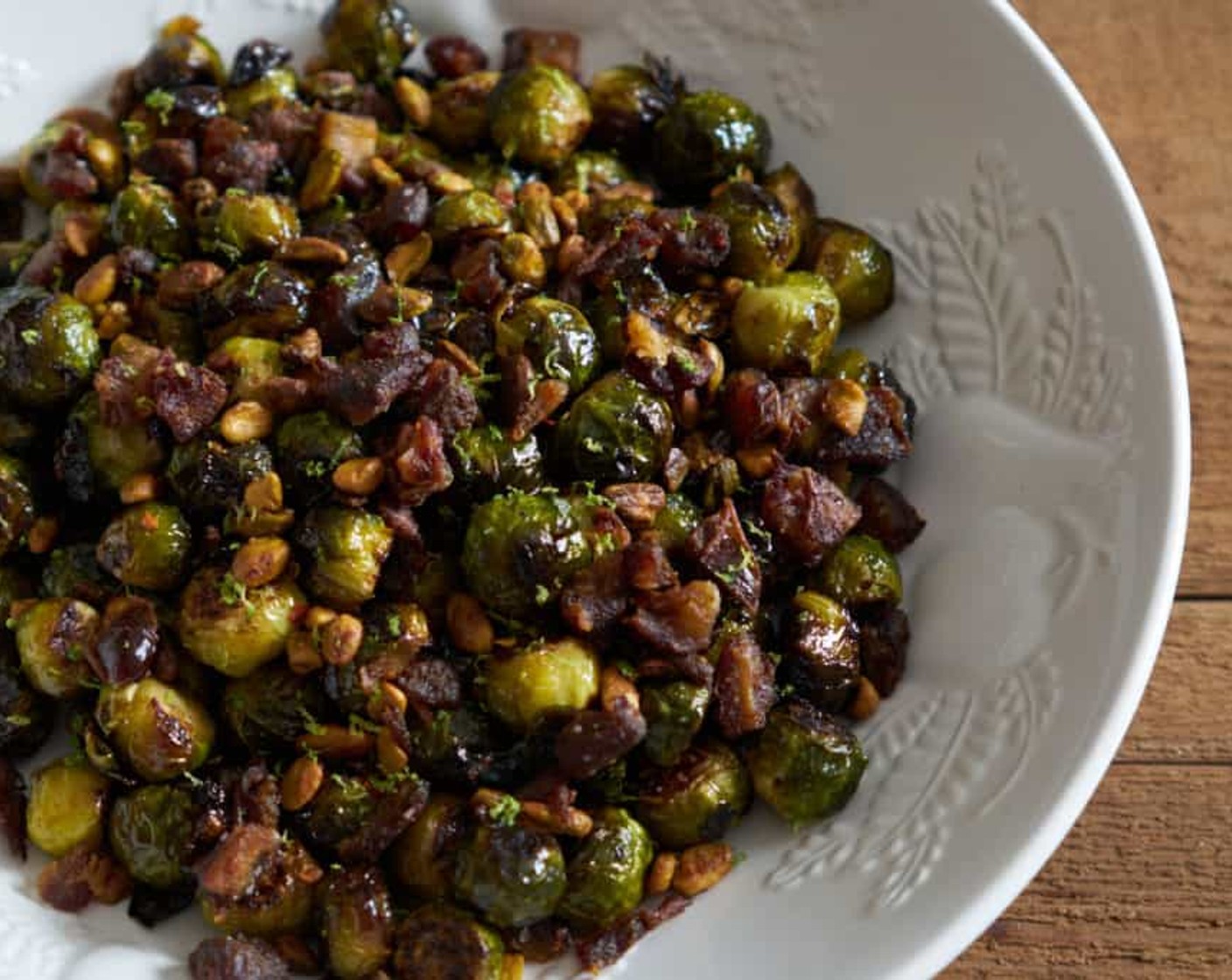 step 13 Transfer the roasted sprouts to a serving dish and top with the pistachio/date mixture and serve.