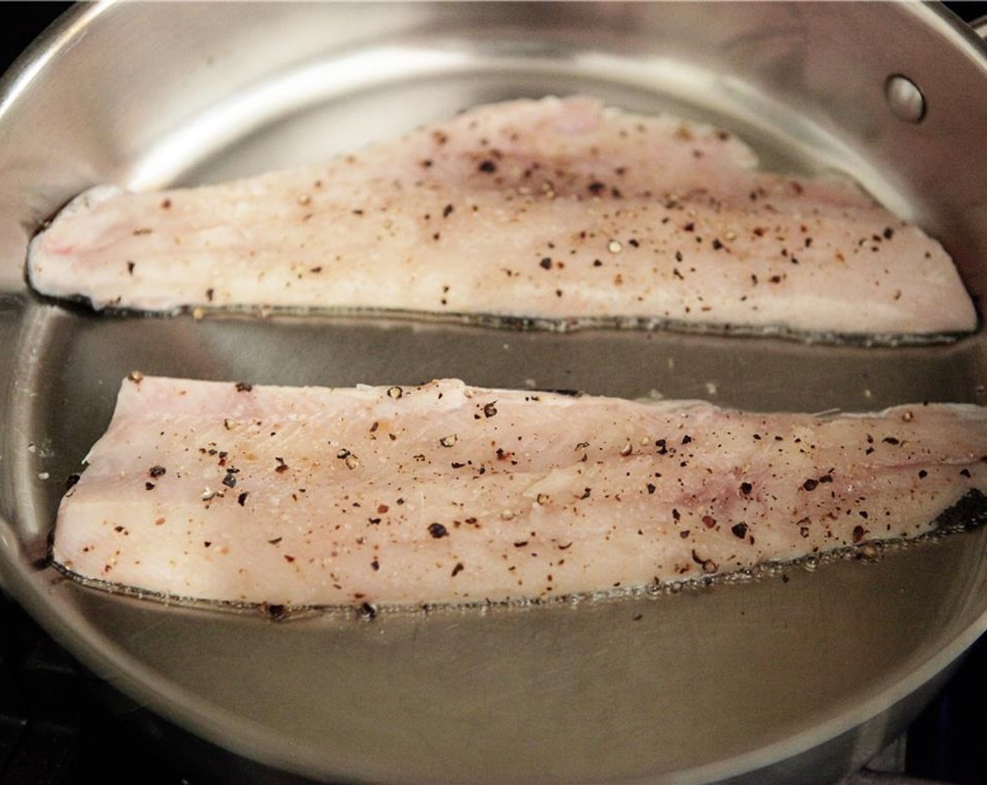 step 5 Add trout filet skin down and cook without turning or moving until the fish is cooked most of the way through and well browned & crisp on the skin side. Remove to a plate, skin side up, and reserve.