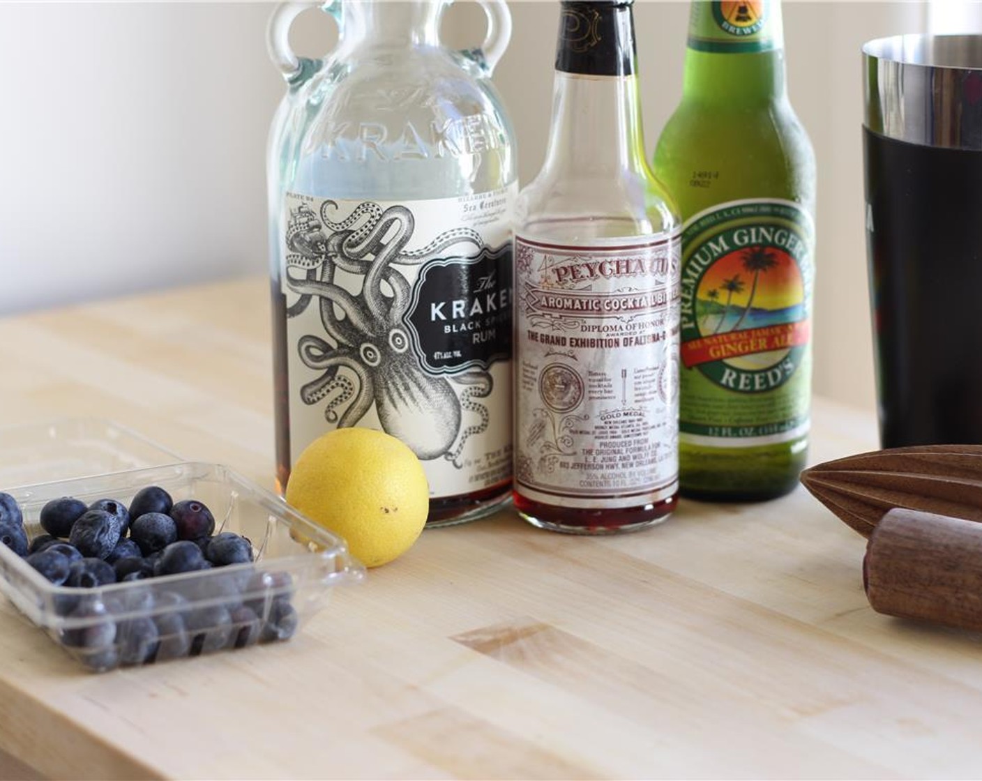 step 1 Assemble ingredients. Put ice in cocktail shaker.