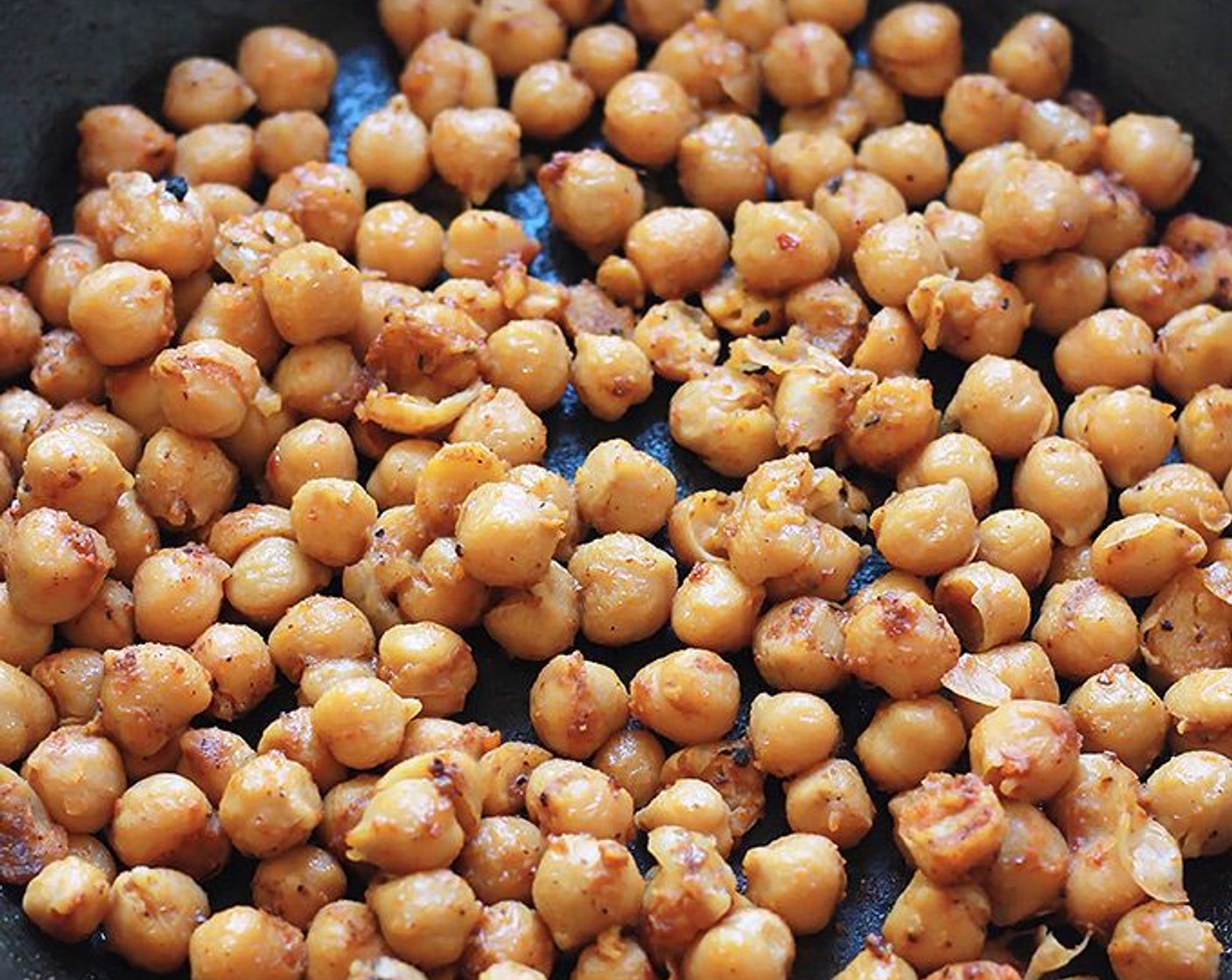 step 4 After sauteing the tofu, add a bit more oil to the pan. Add McCormick® Taco Seasoning Mix (1 packet) to the pan and sprinkle on Chickpeas (2 cans). Saute the chickpeas until well coated and heated.