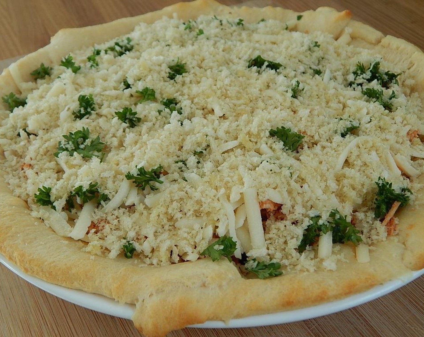 step 8 In a small bowl, mix Olive Oil (1/2 Tbsp). Parmesan Cheese (2 Tbsp), and Panko Breadcrumbs (1/2 cup) and sprinkle the mixture on top of your pie.