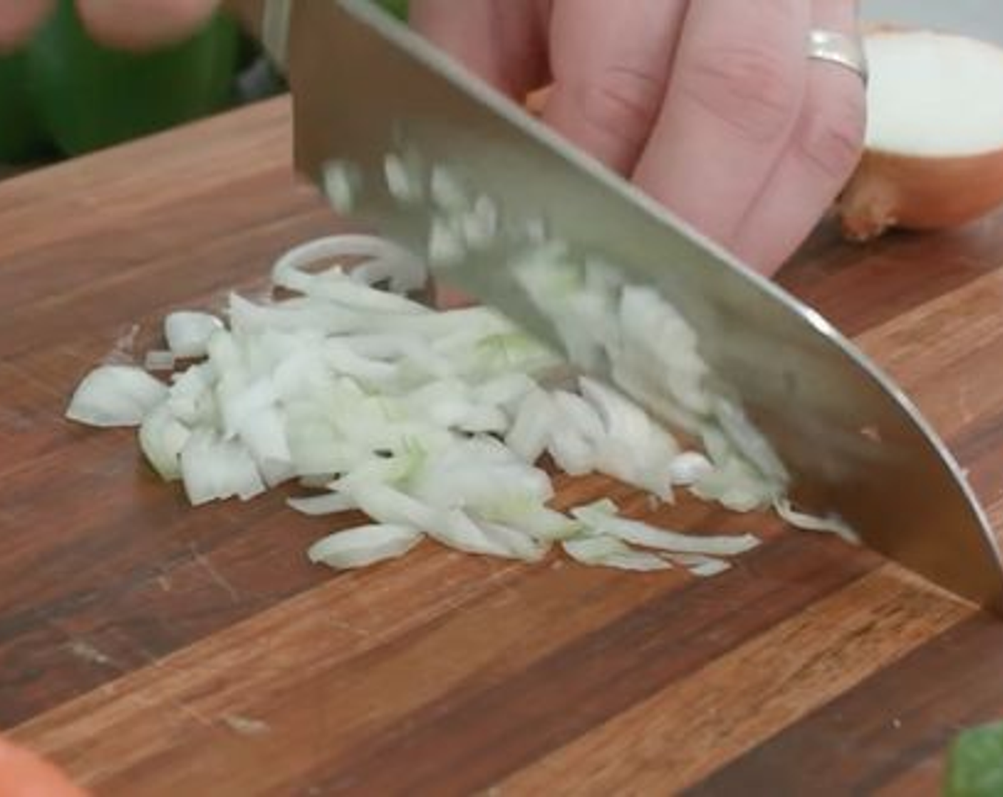 step 2 Finely chop the Onion (1/2) and add to the hot oil.