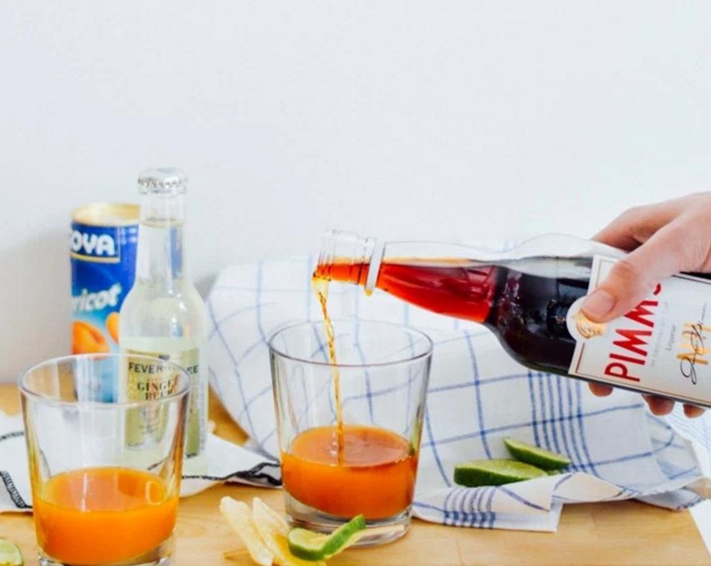 step 2 Add Pimm's (4 Tbsp) into each glass. Add Ginger Beer (120 mL) into each glass.