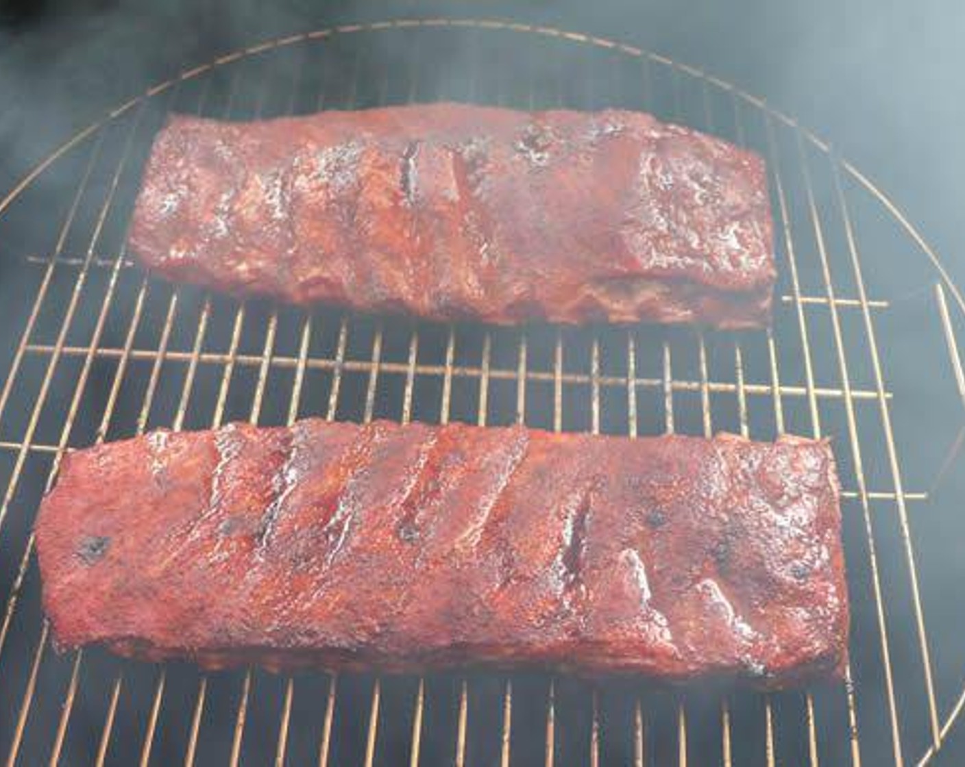 step 4 Place each slab on the smoker and cook for 2 hours spritzing with Apple Juice (12 fl oz) every 30 minutes.