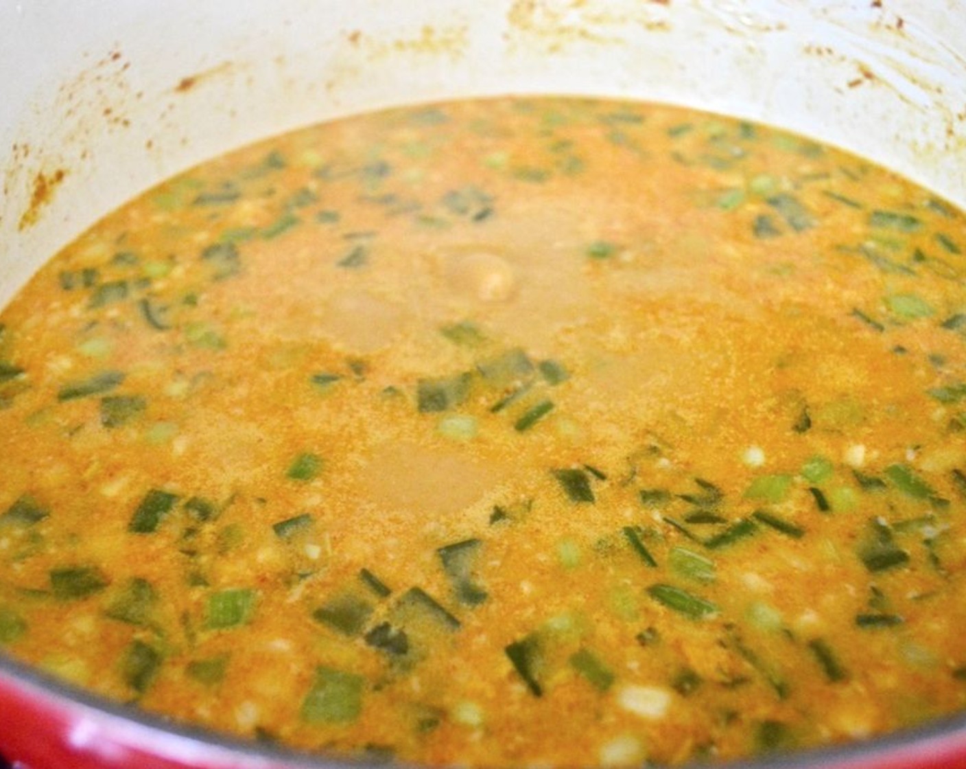 step 4 Pour in the Coconut Cream (1 can), Coconut Milk (2 cans), and Chicken Stock (4 cups). Let the soup simmer on medium for 30 minutes.