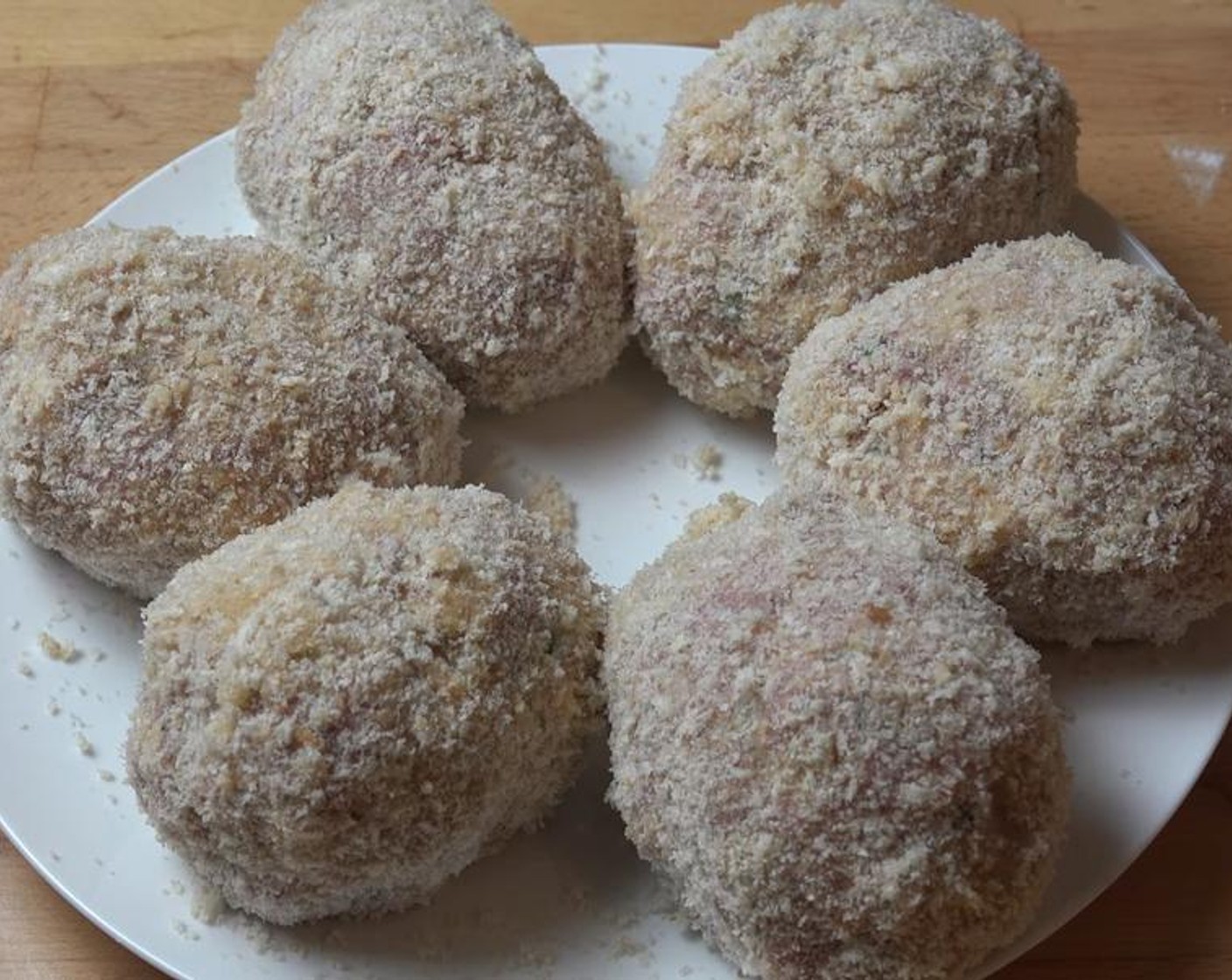 step 5 Season the All-Purpose Flour (1 cup) with Salt (to taste) and Ground Black Pepper (to taste). Beat the 3 remaining Eggs (3). Dredge a scotch egg in seasoned flour and egg. Shake off any access egg, and coat with Breadcrumbs (2 cups). Repeat with remaining scotch eggs.