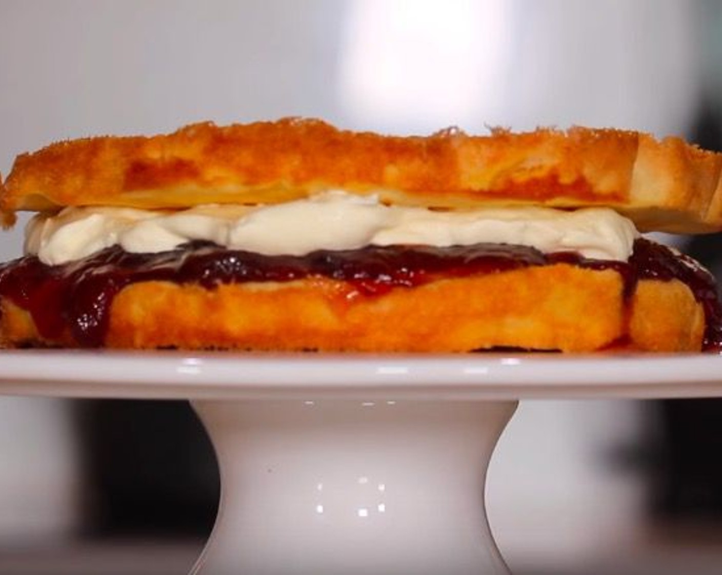 step 9 Spread one cake with Strawberry Jam (to taste) and Whipped Cream (to taste), then top with the other cake.