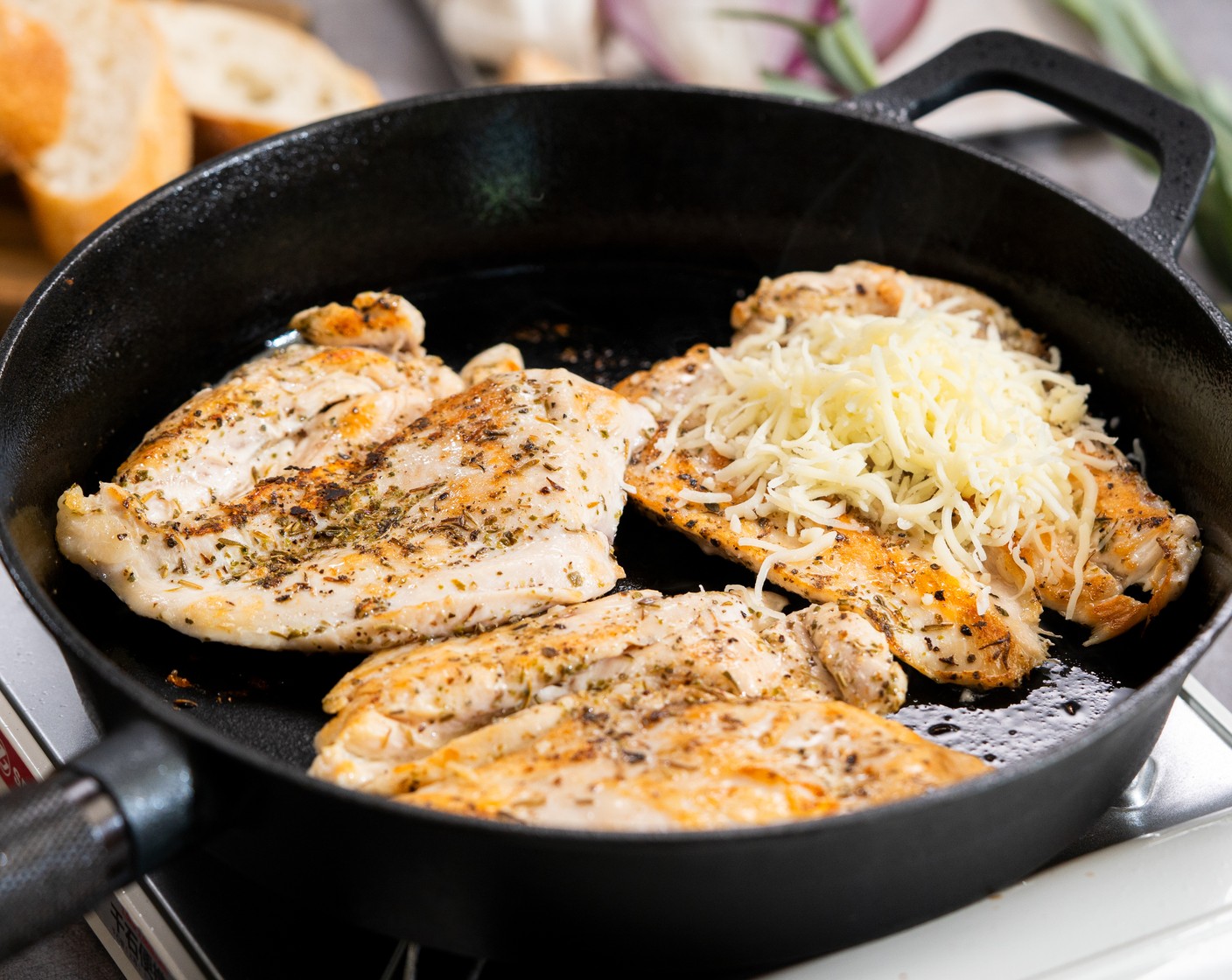 step 4 Flip the chicken and top each piece of chicken with Shredded Mozzarella Cheese (1 cup). Cover with a lid and cook for 1-2 minutes until the cheese is melted. Remove from the heat.