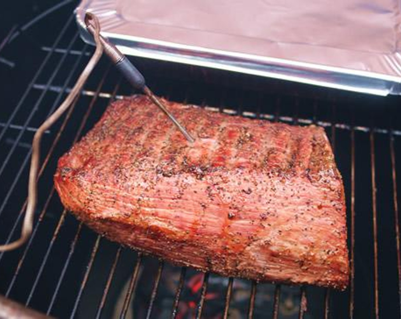 step 5 Turn the roast after 30 minutes of smoking to brown both sides. Insert a meat probe thermometer set for an internal temperature of 130 degrees F (55 degrees C) (medium rare).