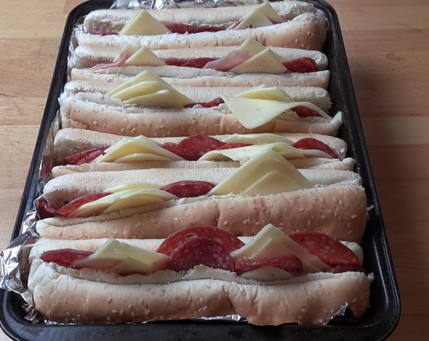 step 4 Place sandwiches into a baking tin lined with foil.