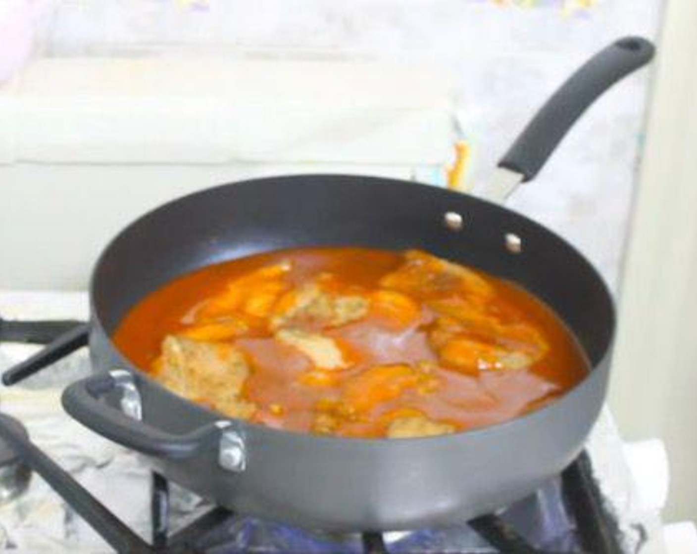 step 3 In a large saucepan over medium heat, add the Enchilada Sauce (2 1/4 cups). Place the seasoned chicken over top, cover, and cook for 10-15 minutes.